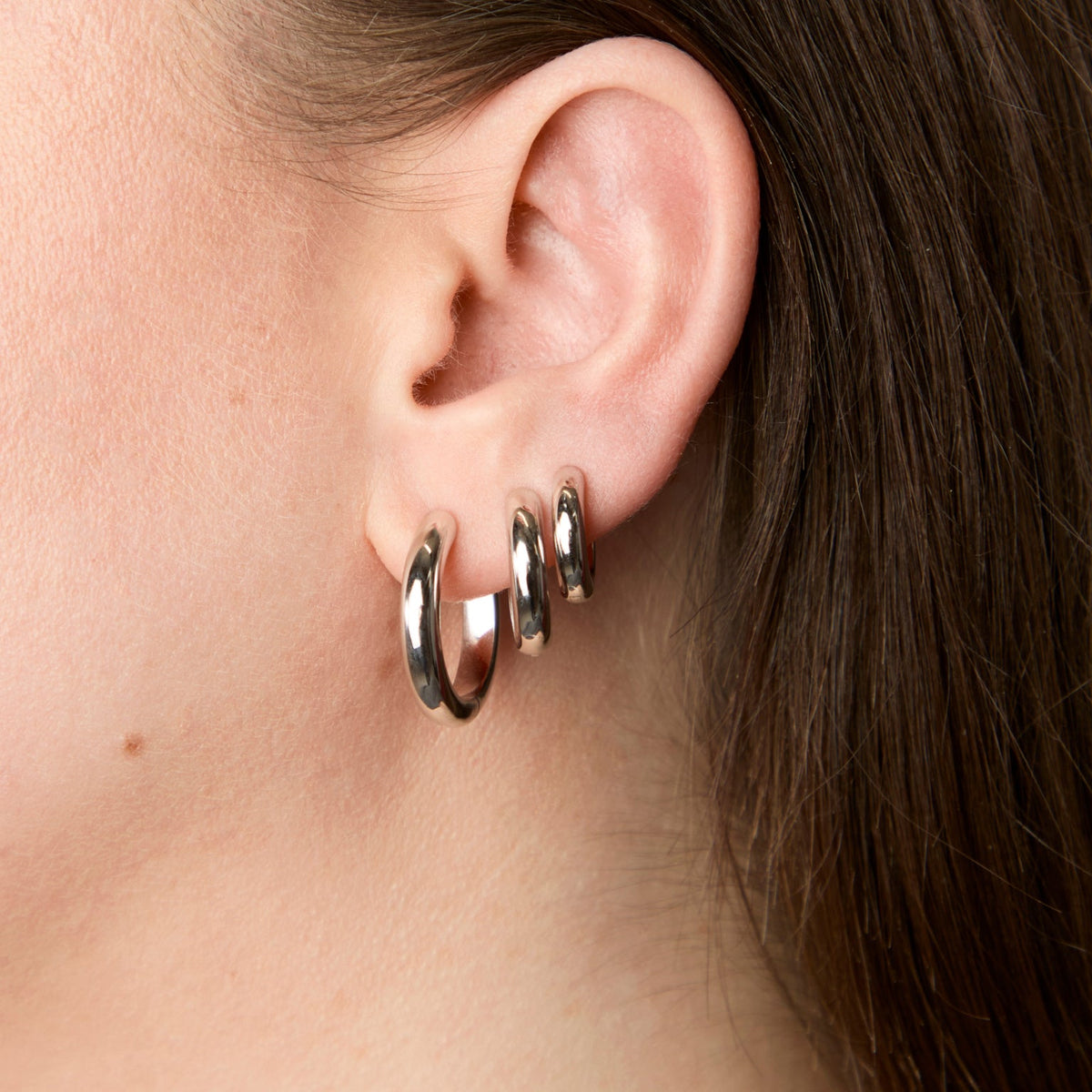 Everyday jewellery essential pieces, including a necklace and hoop earrings