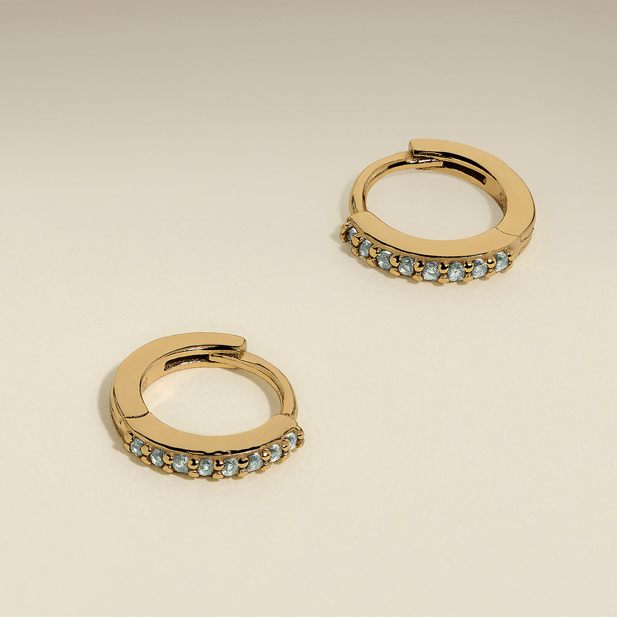 March Birthstone Huggies in Gold with Aquamarine CZ-Astrid & Miyu