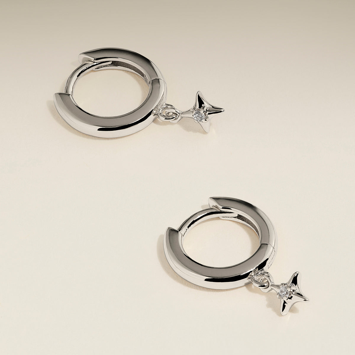 Cosmic Star Charm Huggies in Silver