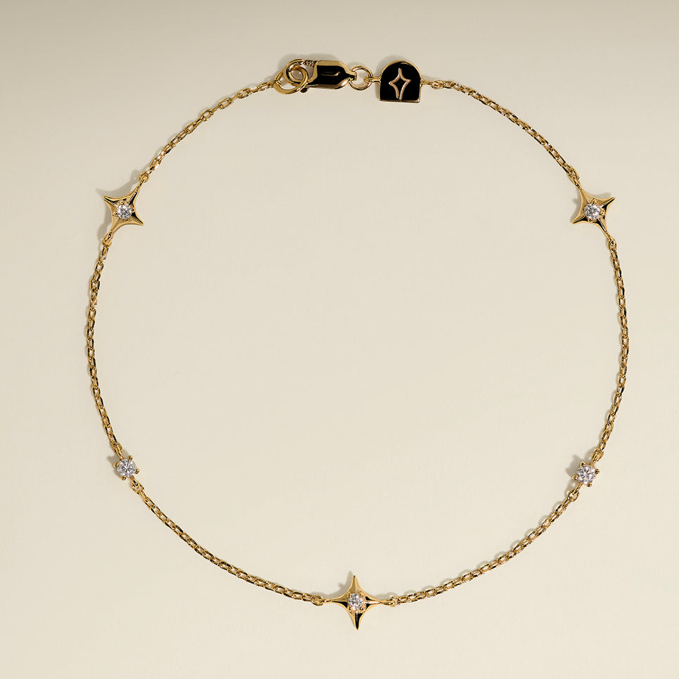 Cosmic Star Charm Bracelet in Gold