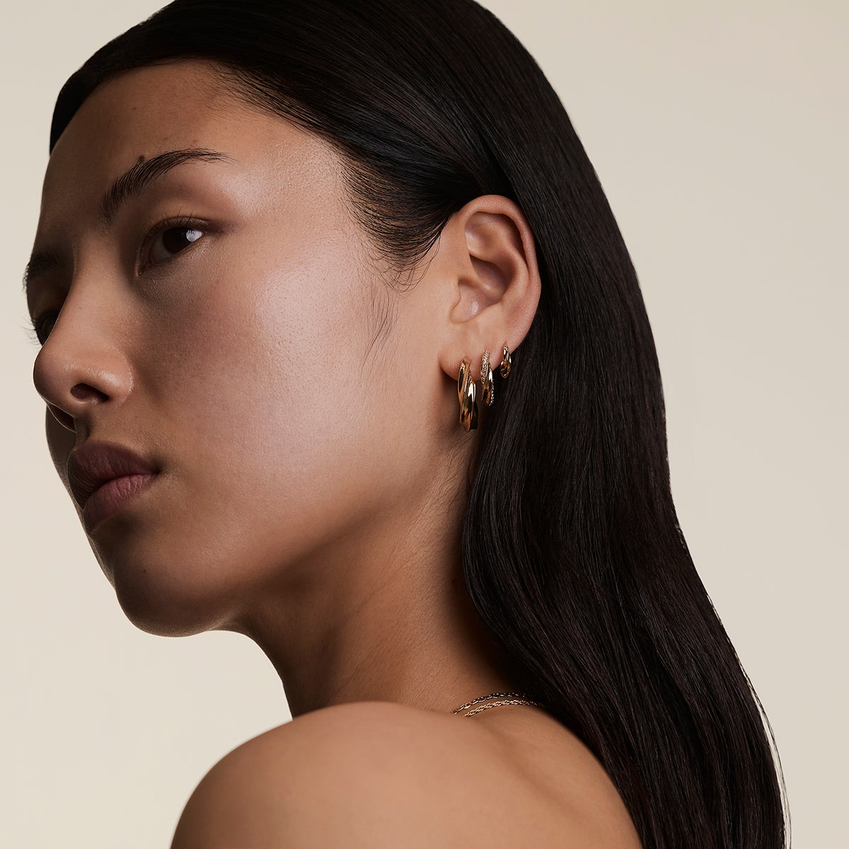 Crystal Cosmic Twist Medium Hoops in Gold-Astrid & Miyu