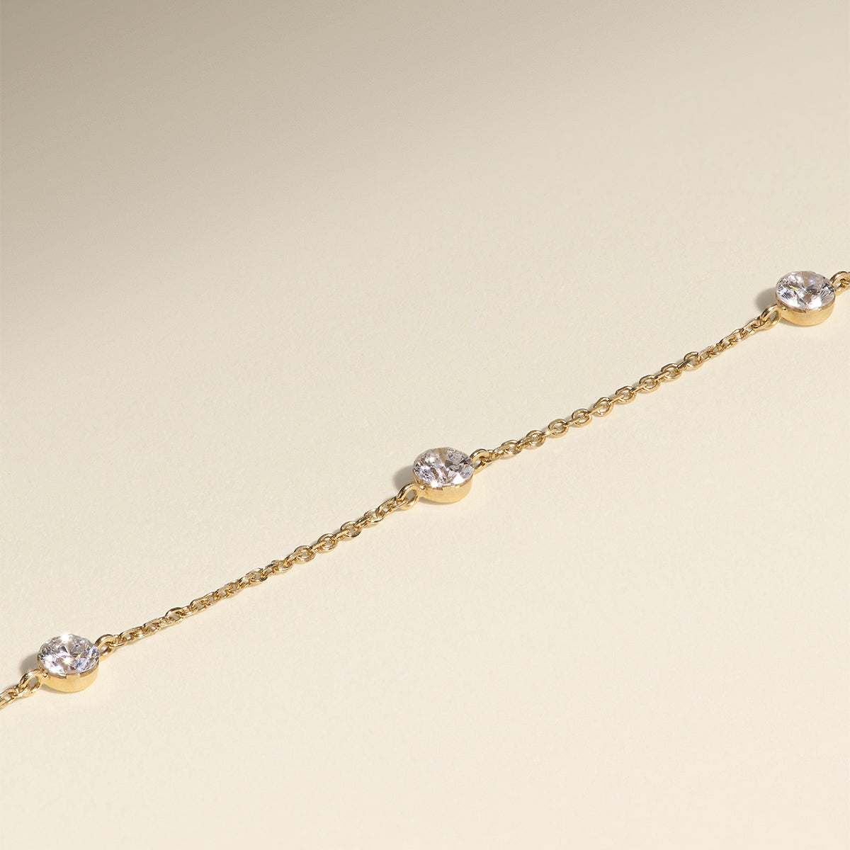 Floating Diamond Charm Bracelet in Solid Gold