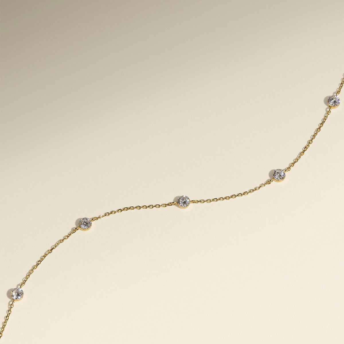 Floating Diamond Charm Bracelet in Solid Gold