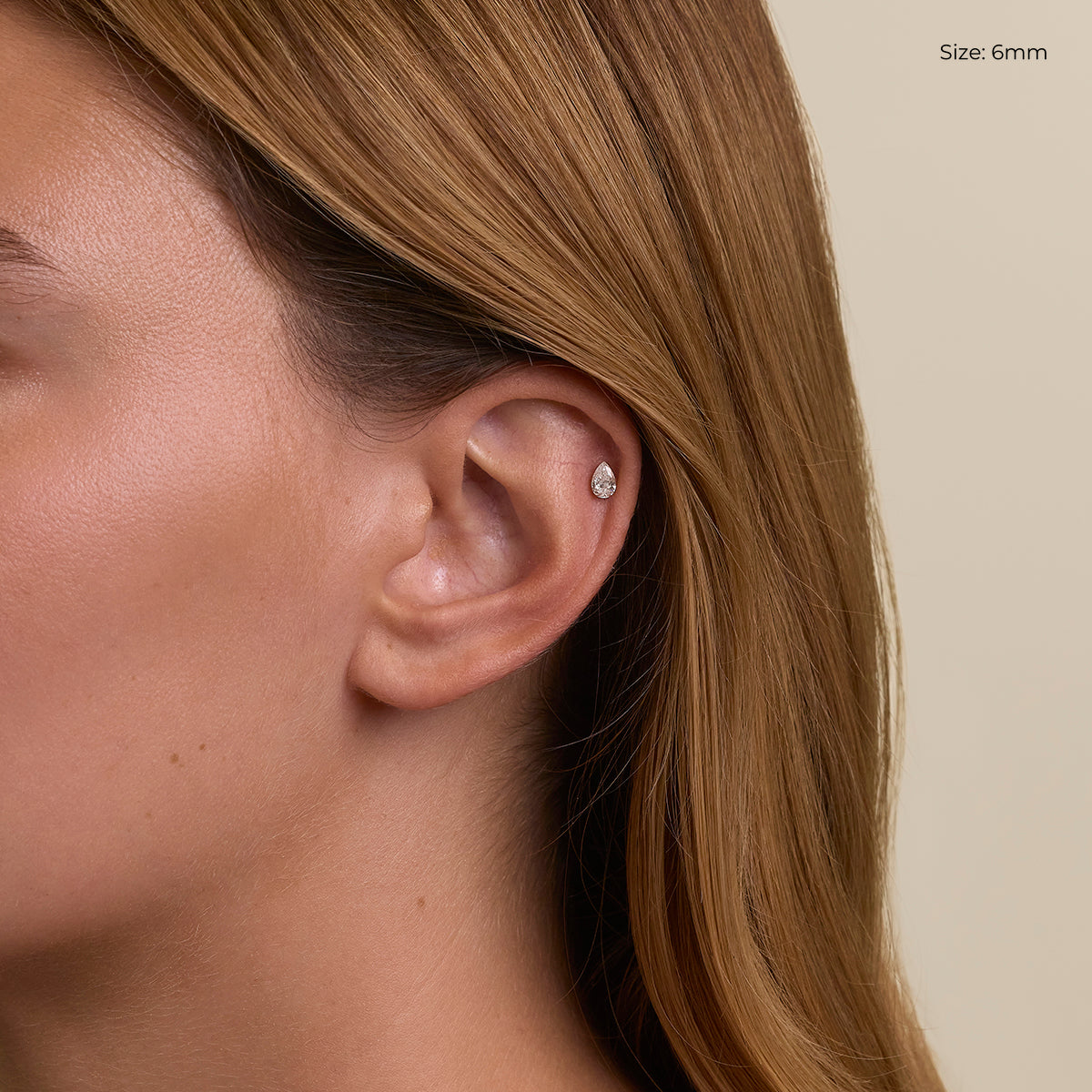 Floating Pear Diamond Stud Earrings in Solid Gold
