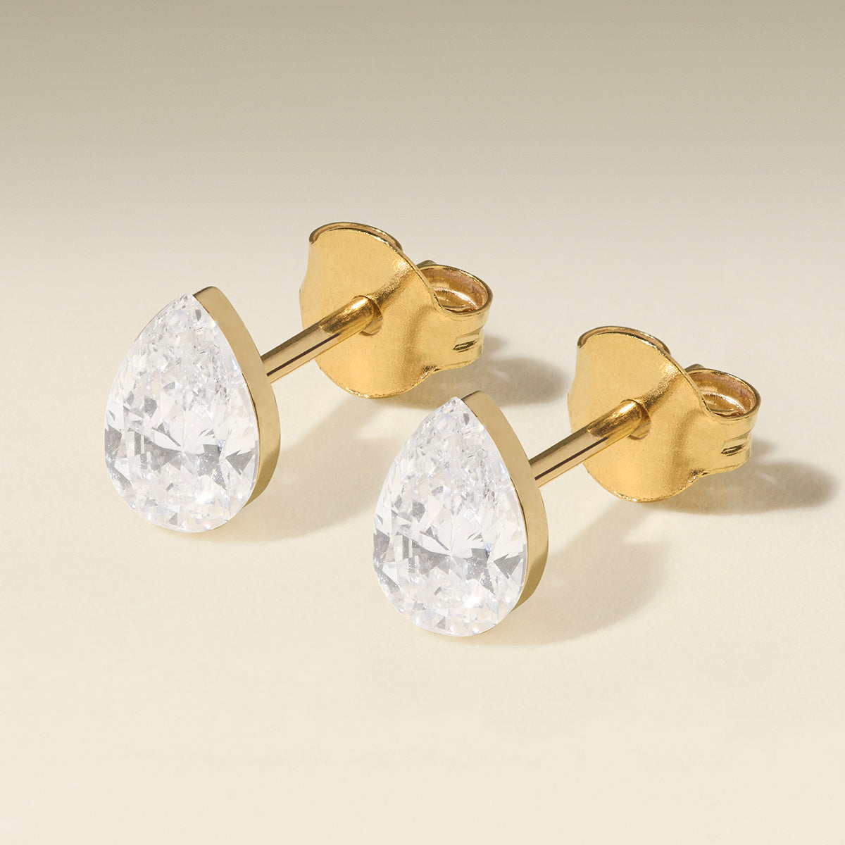 Floating Pear Diamond Stud Earrings in Solid Gold