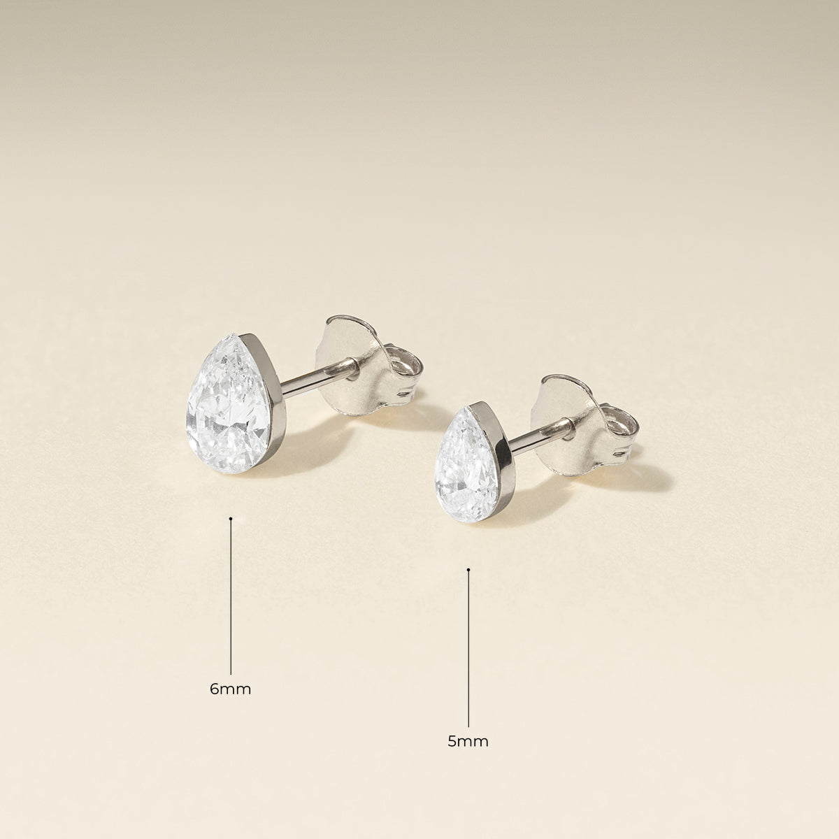 Floating Pear Diamond Stud Earrings in Solid White Gold