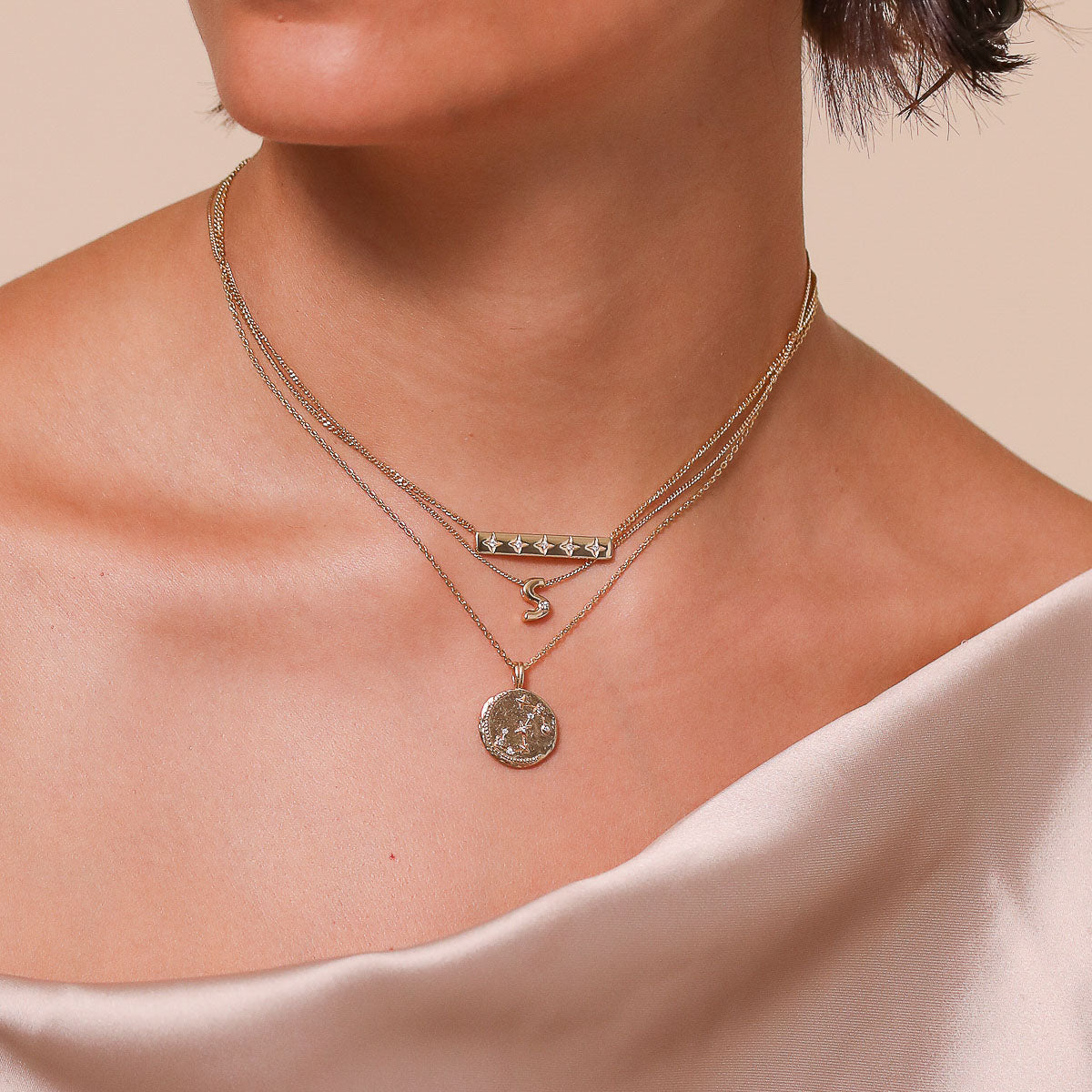 Scorpio Zodiac Pendant Necklace in Gold worn layered with necklaces