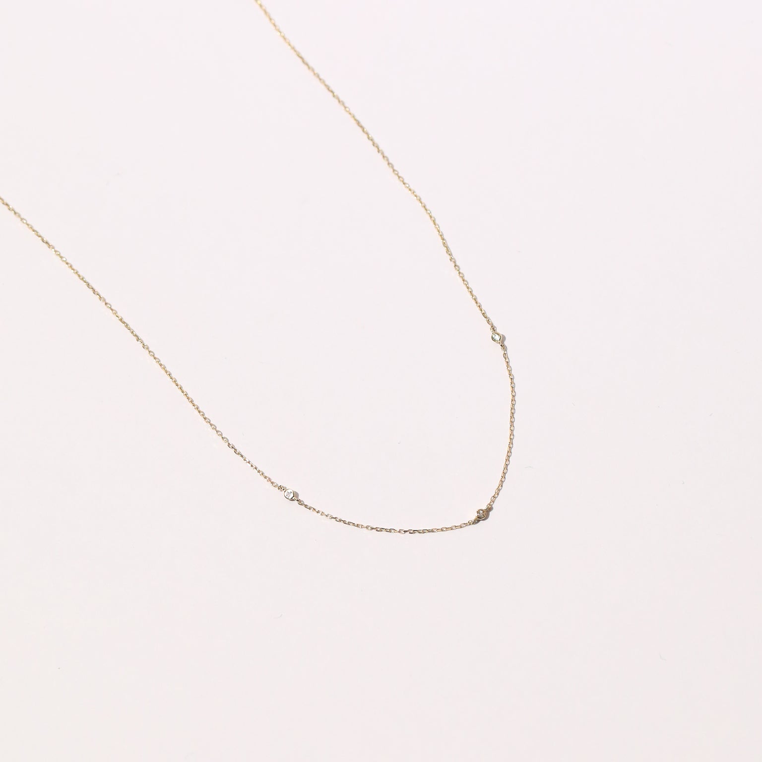 Topaz Charm Necklace in Solid Gold flat lay