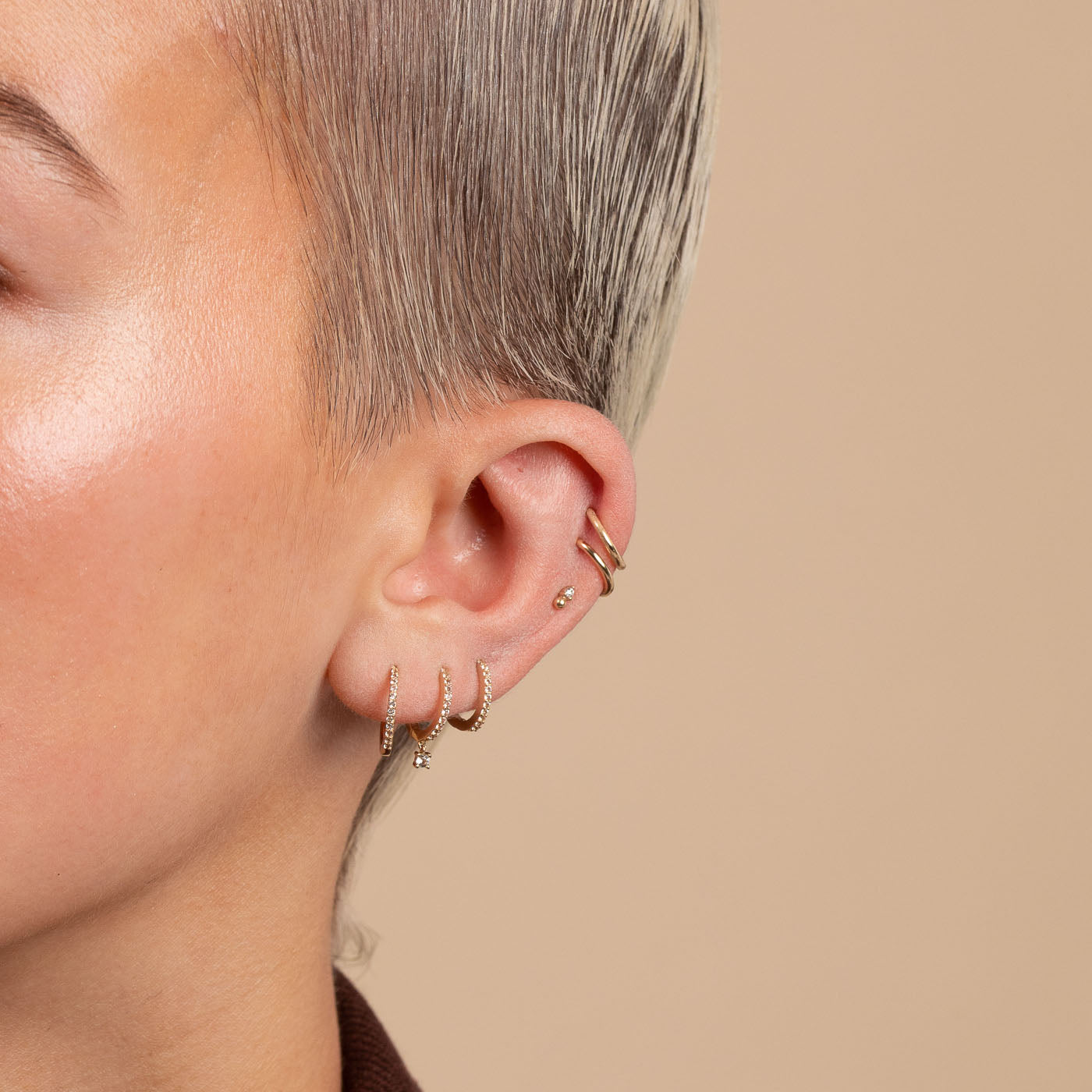 Topaz Charm Hoops in Solid Gold Worn with other earrings