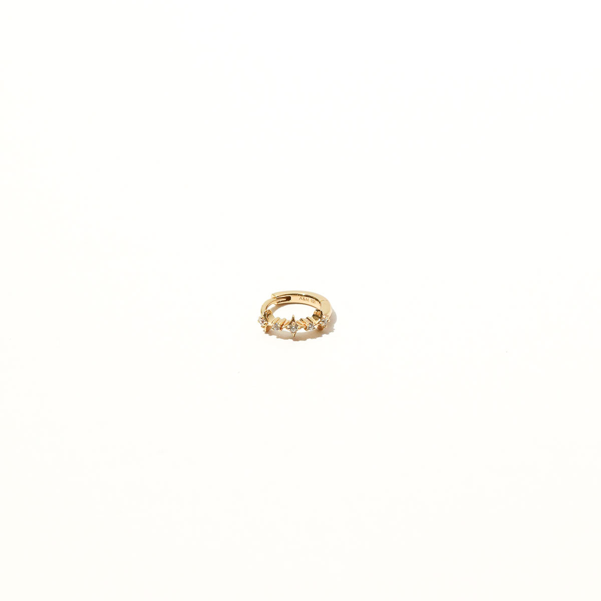 Cosmic Star 6.5mm Hoop in Gold flat lay