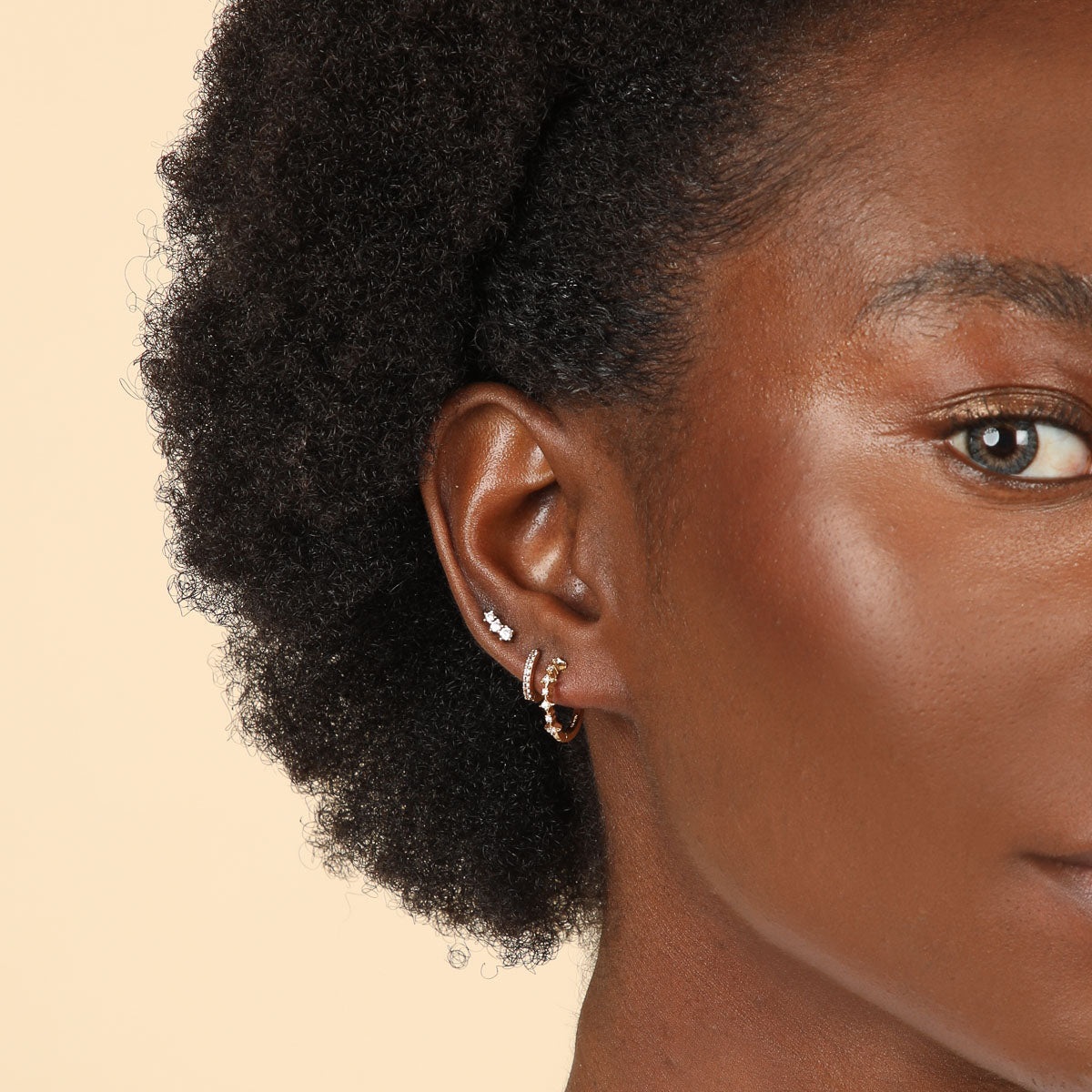 Glimmer Crystal Climber Stud Earrings in Gold worn with other earrings