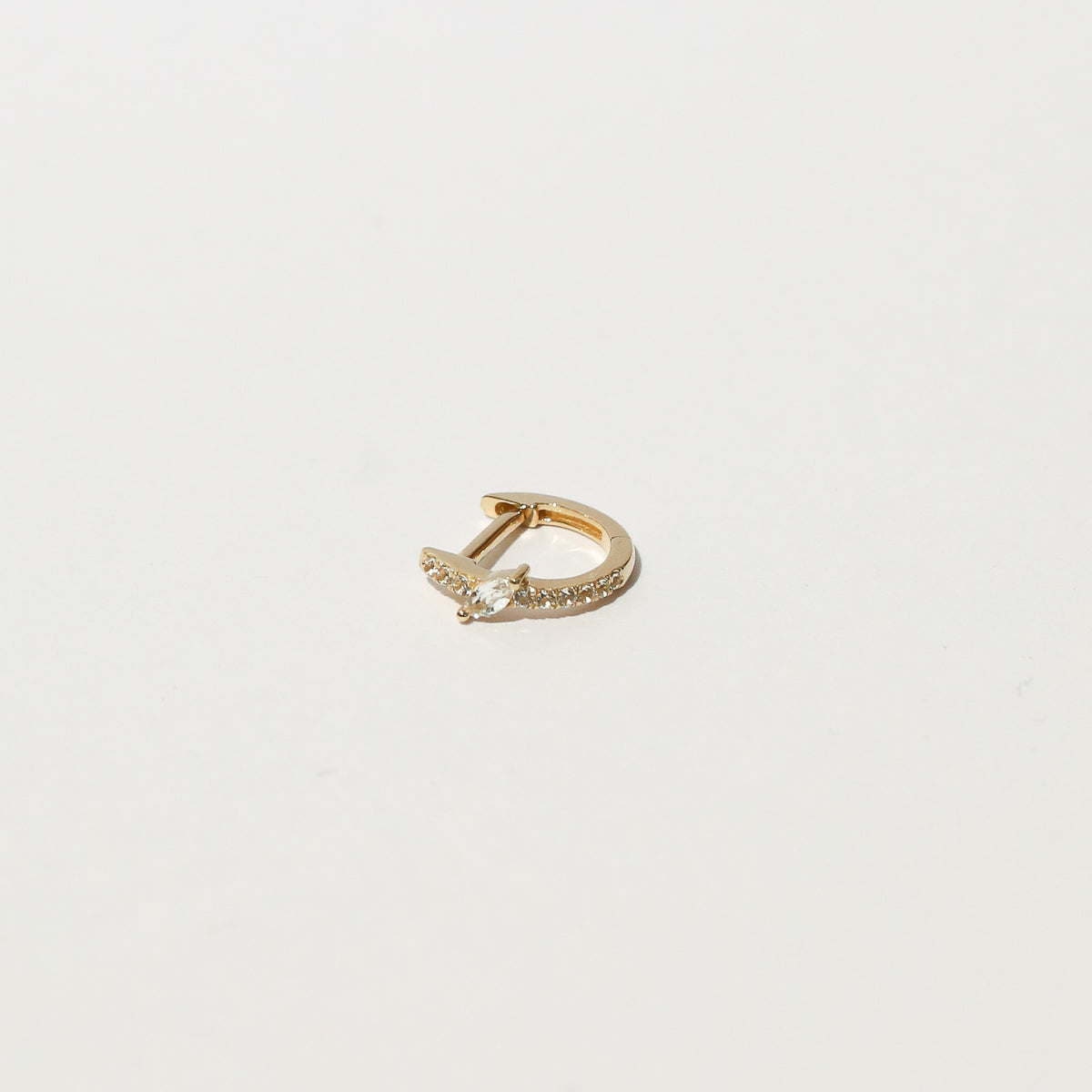 Marquise Gem Piercing Hoop in Solid Gold flat lay