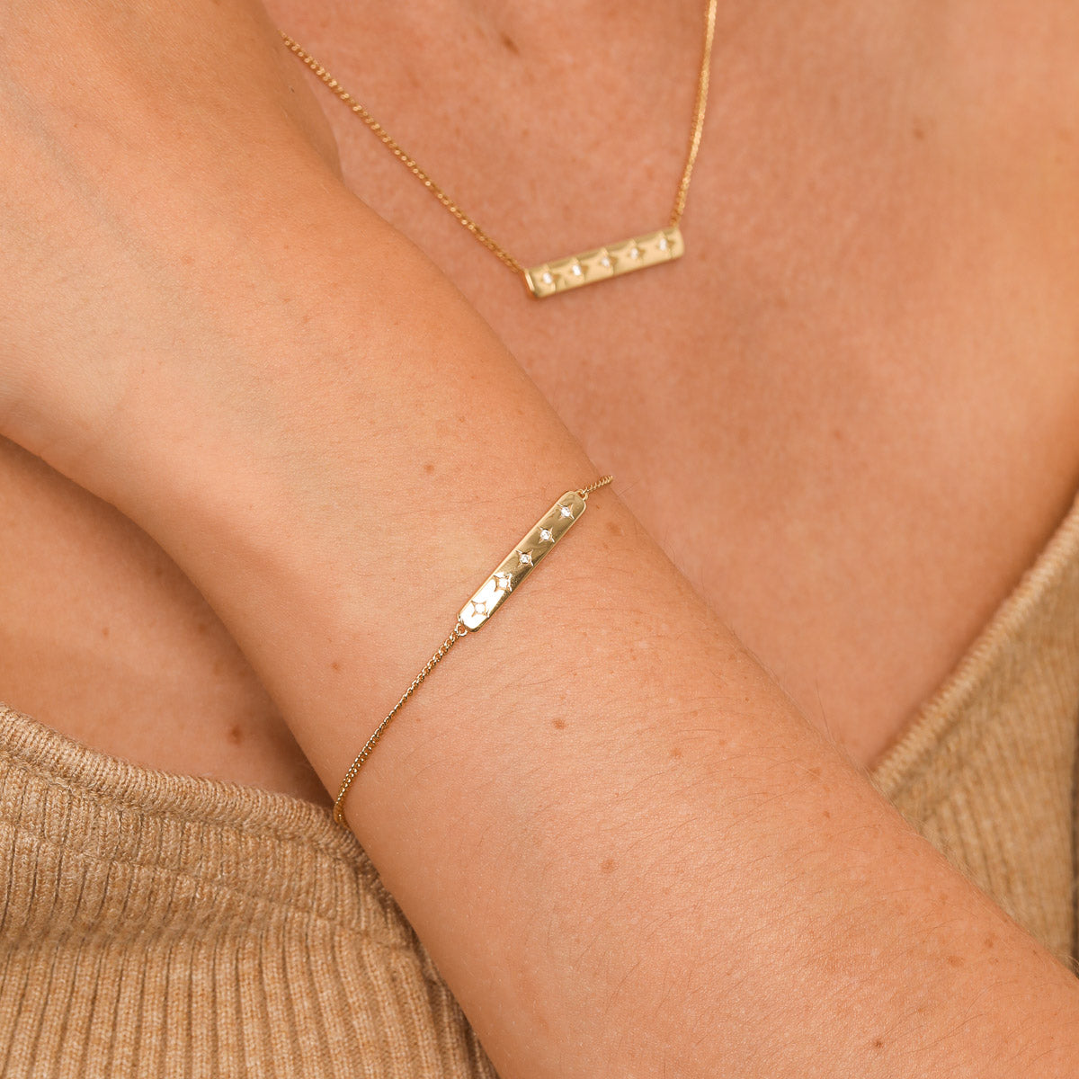 Cosmic Star Bar Bracelet in Gold worn