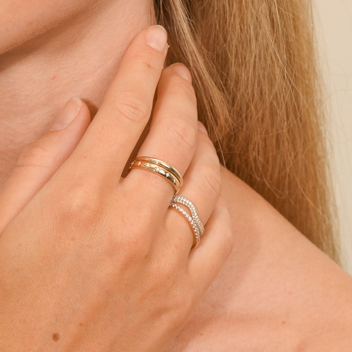 Cosmic Star Stacking Ring in Gold worn stacked with other rings
