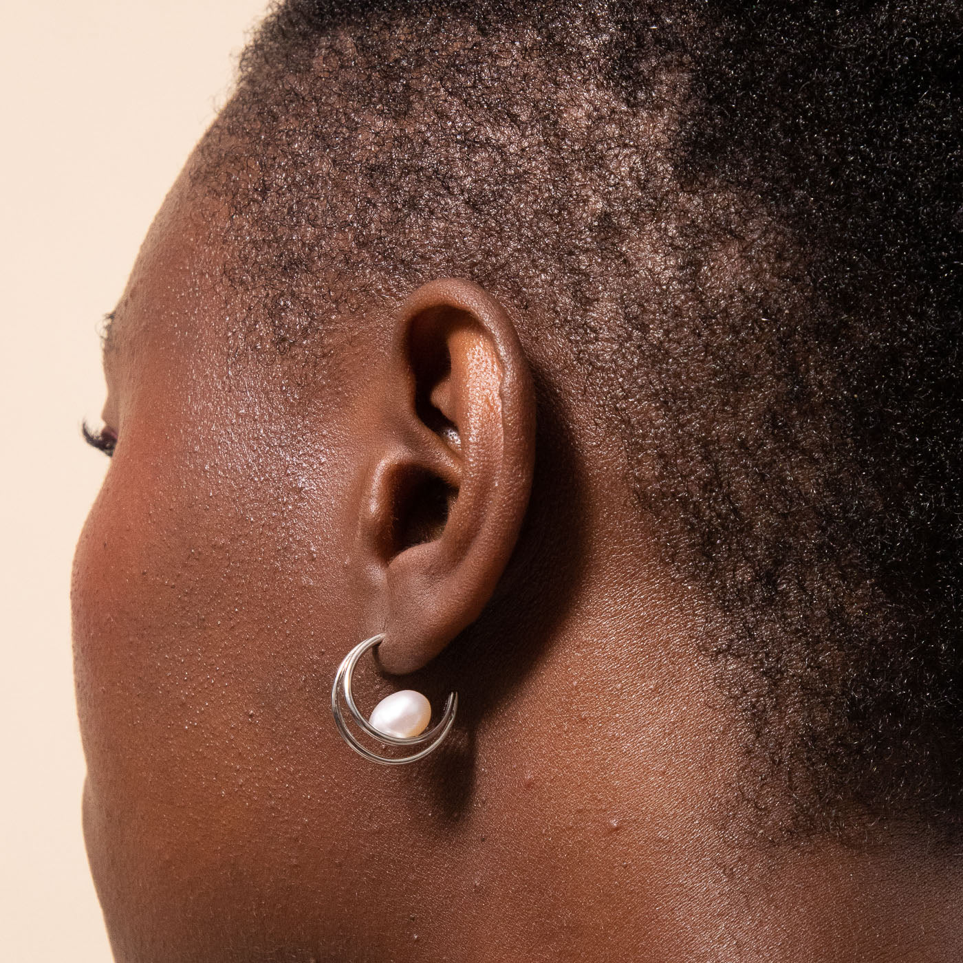 Opulent Pearl Hoops in Silver worn
