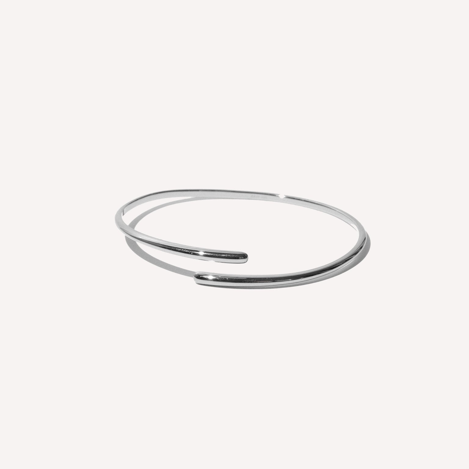 Twist Cuff in Silver flat lay