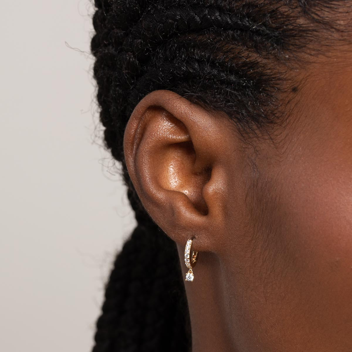 Charm Crystal Huggies in Gold worn