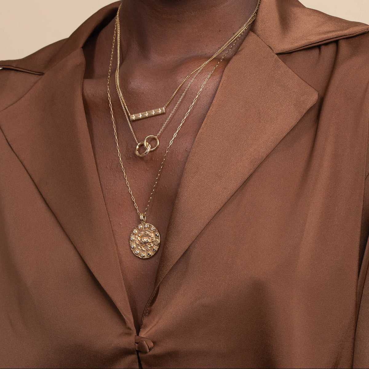 Cancer Bold Zodiac Pendant Necklace in Gold worn layered with necklaces