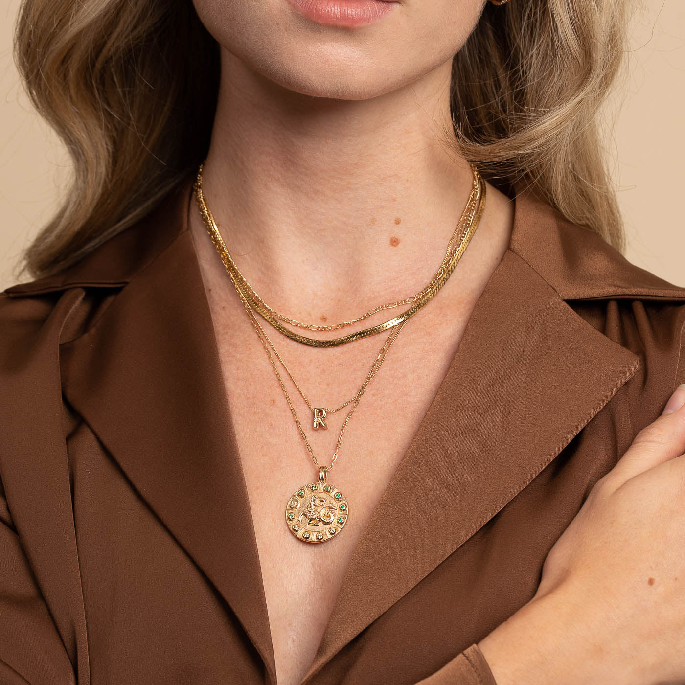 Capricorn Bold Zodiac Pendant Necklace in Gold worn with necklaces