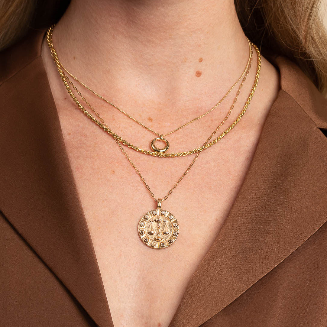 Libra Bold Zodiac Pendant Necklace in Gold worn layered with necklaces