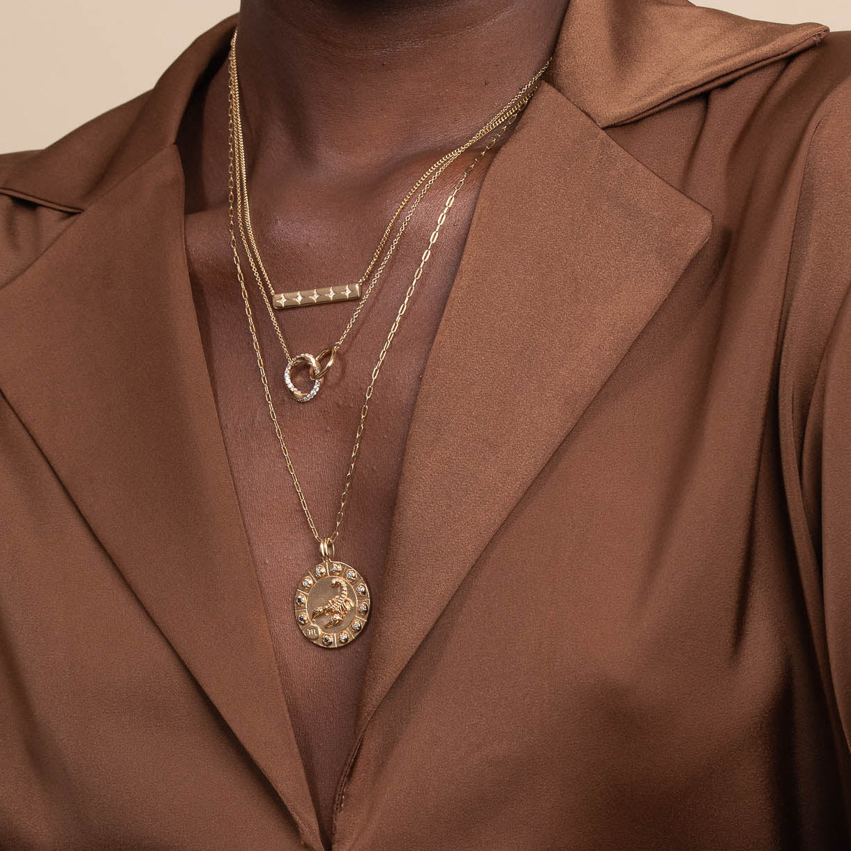 Scorpio Bold Zodiac Pendant Necklace in Gold worn layered with necklaces