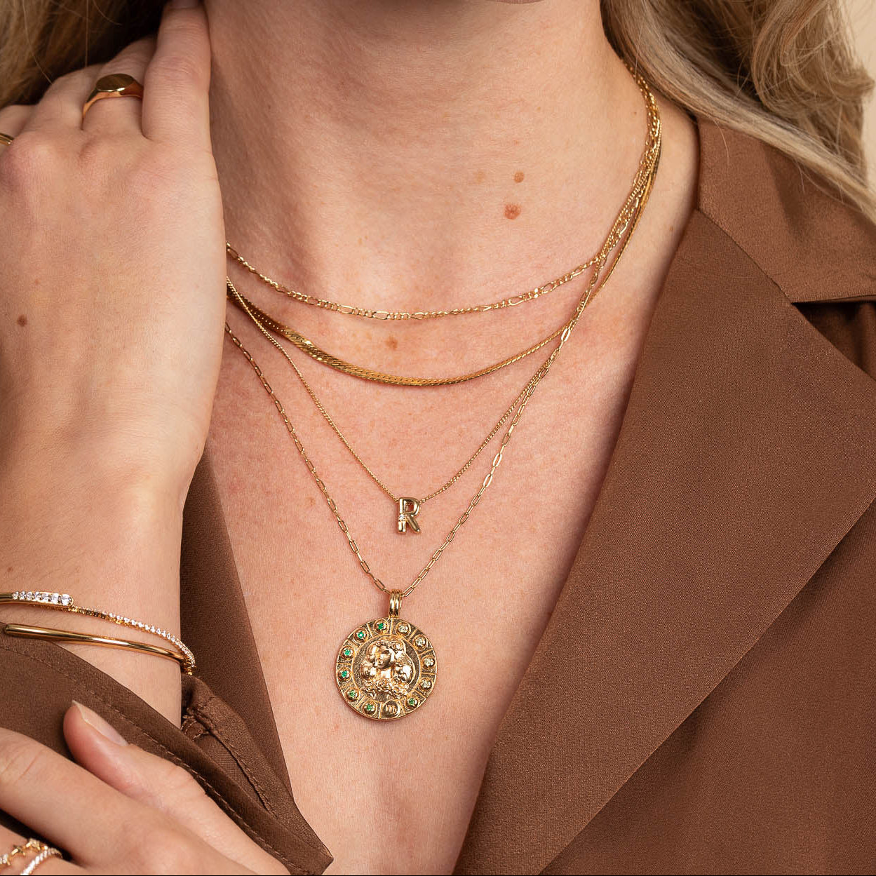 Virgo Bold Zodiac Pendant Necklace in Gold worn layered with necklaces