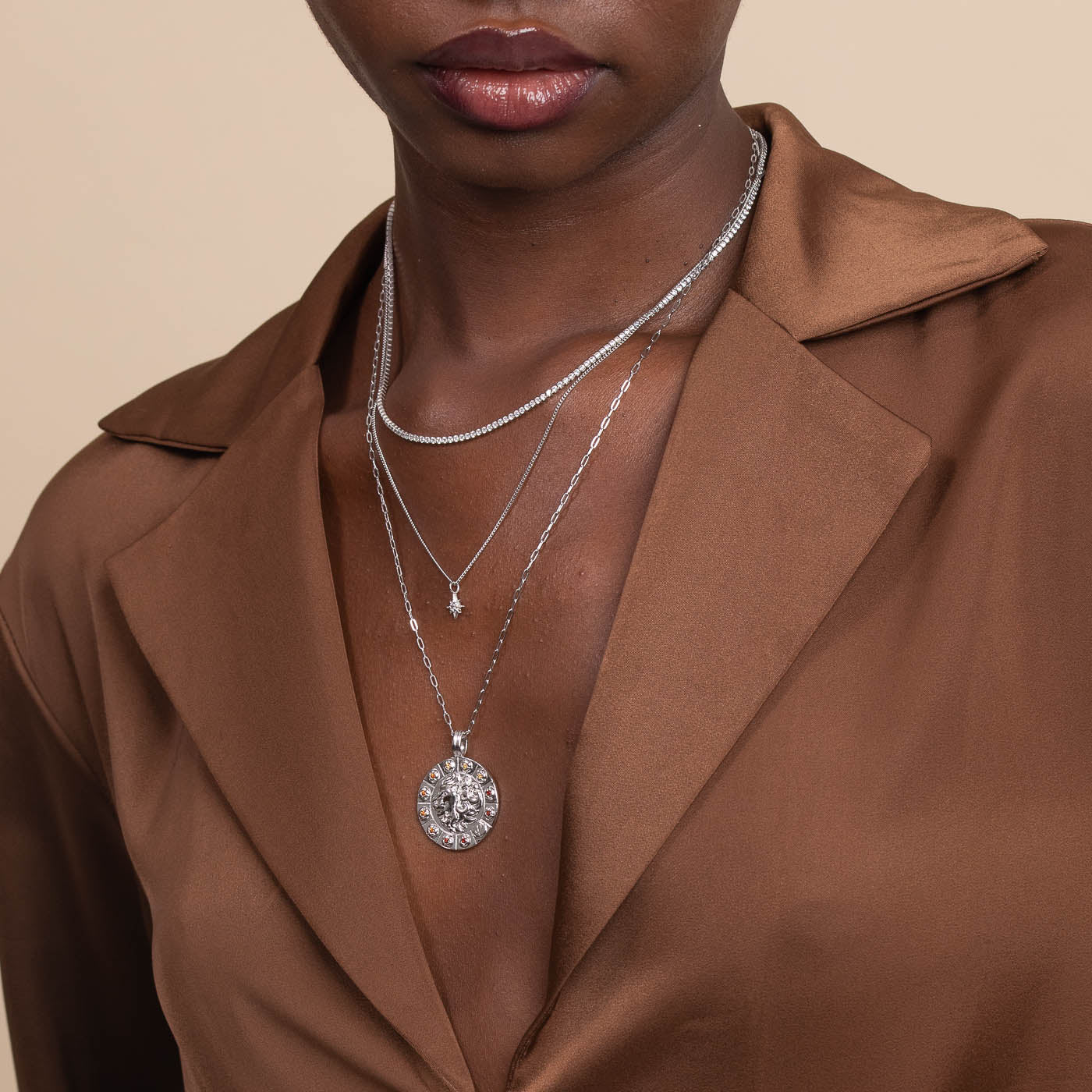 Bold Zodiac Leo Pendant Necklace in Silver worn layered with tennis chain necklace and twilight star pendant necklace