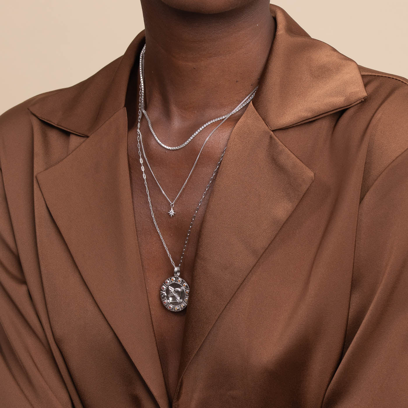 Sagittarius Bold Zodiac Pendant Necklace in Silver worn layered with necklaces