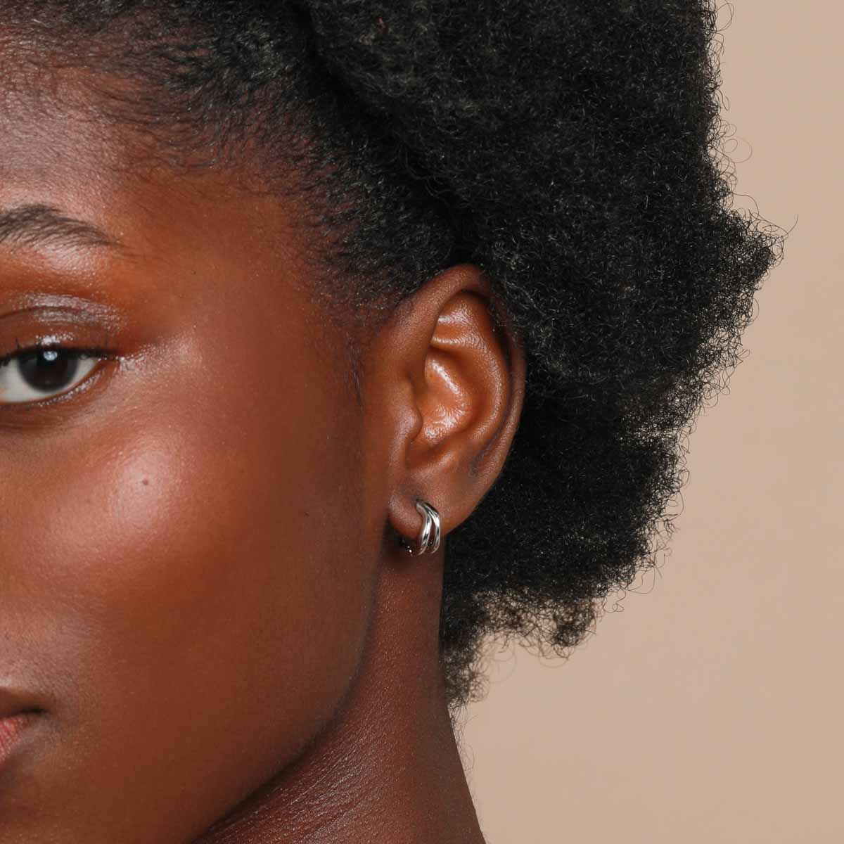 Worn shot of Molten Duo Huggies in Silver