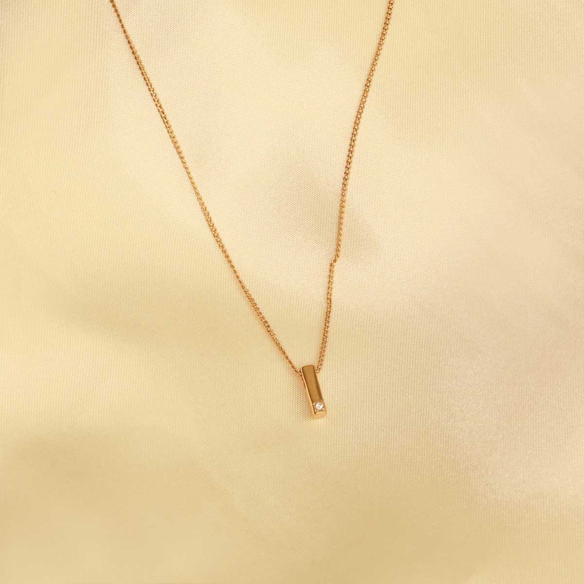 Flat lay shot of I Initial Pendant Necklace in Gold