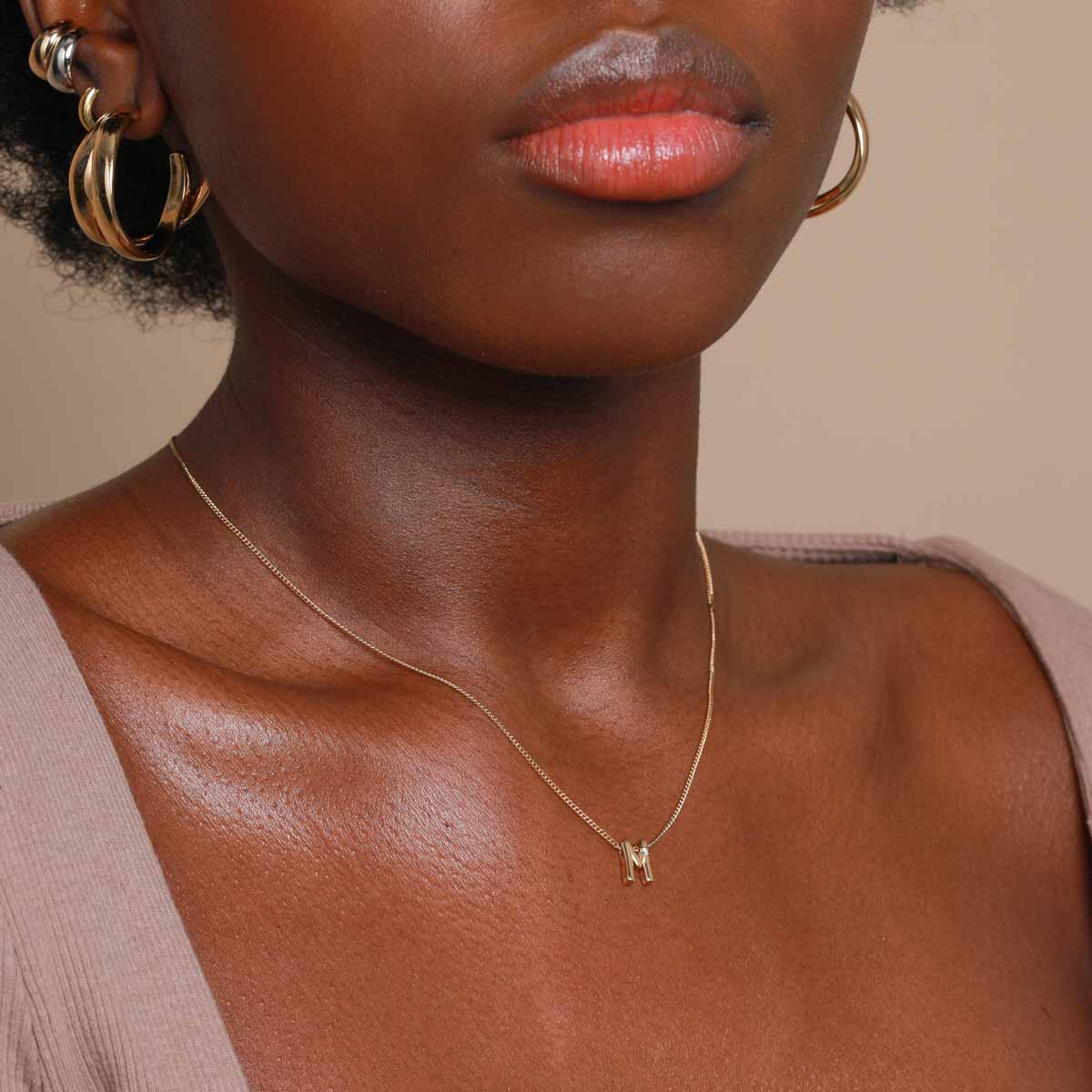 M Initial Pendant Necklace in Gold worn