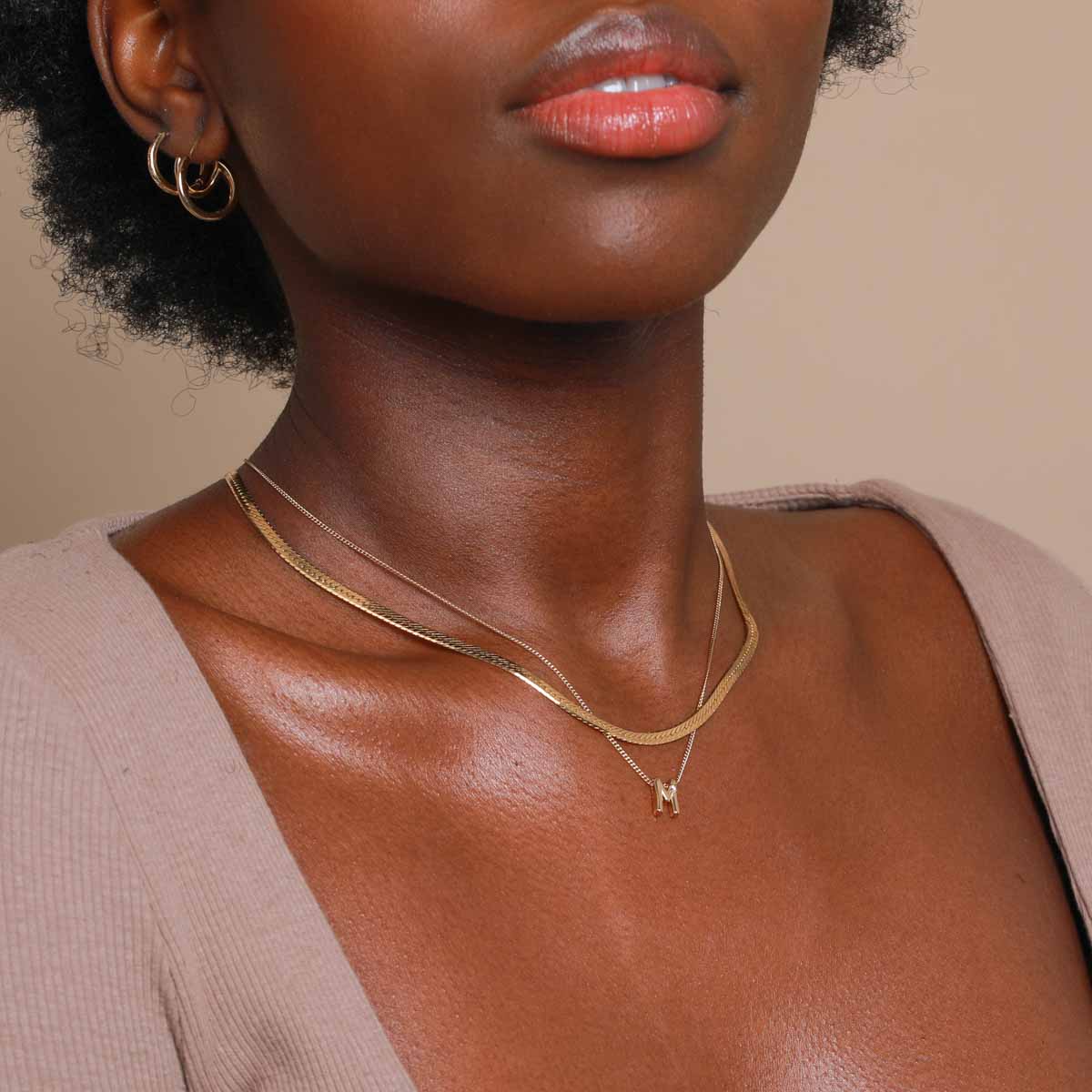 M Initial Pendant Necklace in Gold worn with snake chain necklace