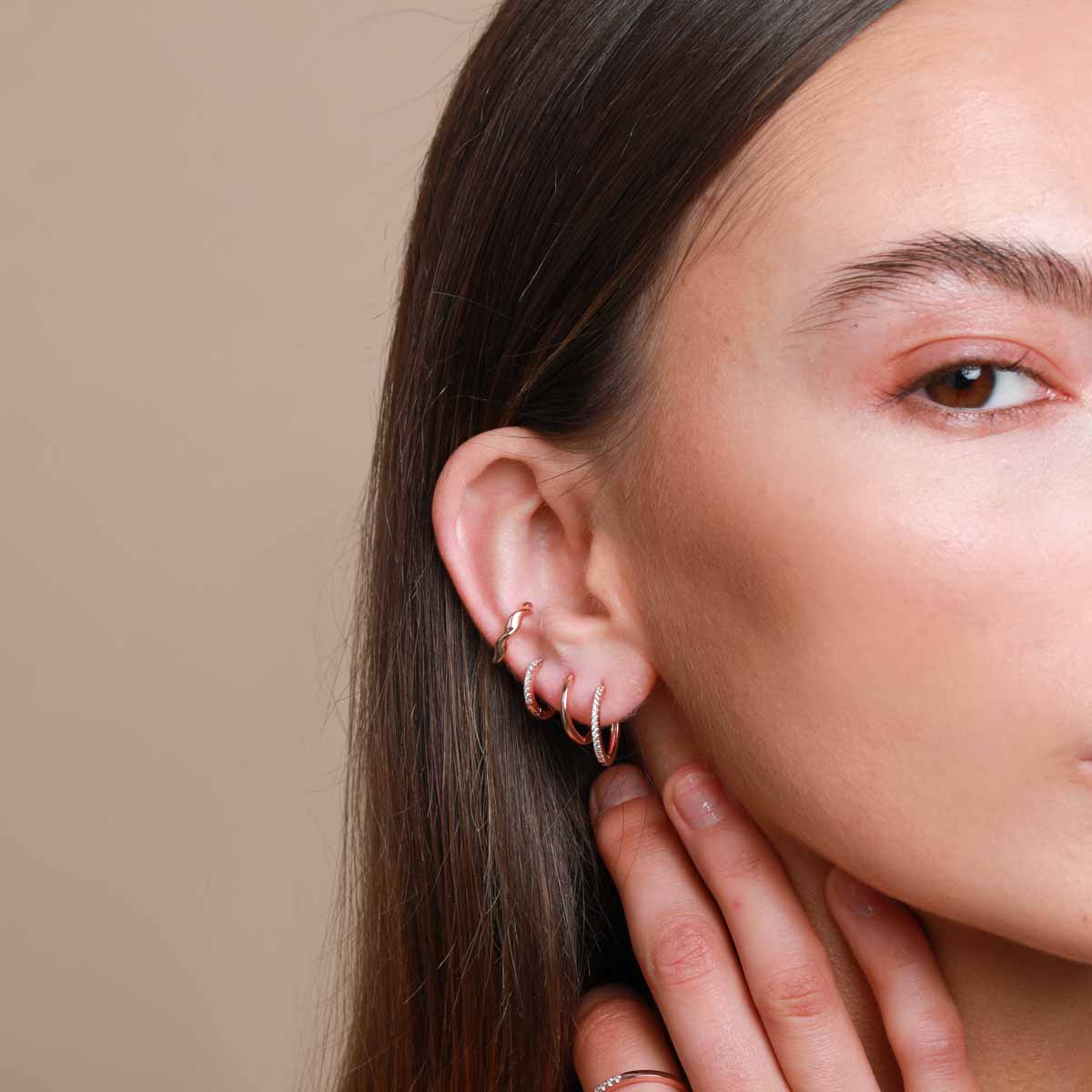 Worn shot of Jewelled Hoop 11.5mm in Rose Gold in lobe piercing location