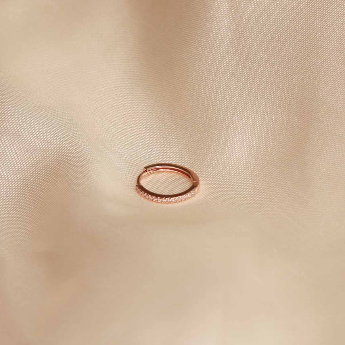 Flat lay shot of Jewelled Hoop 11.5mm in Rose Gold