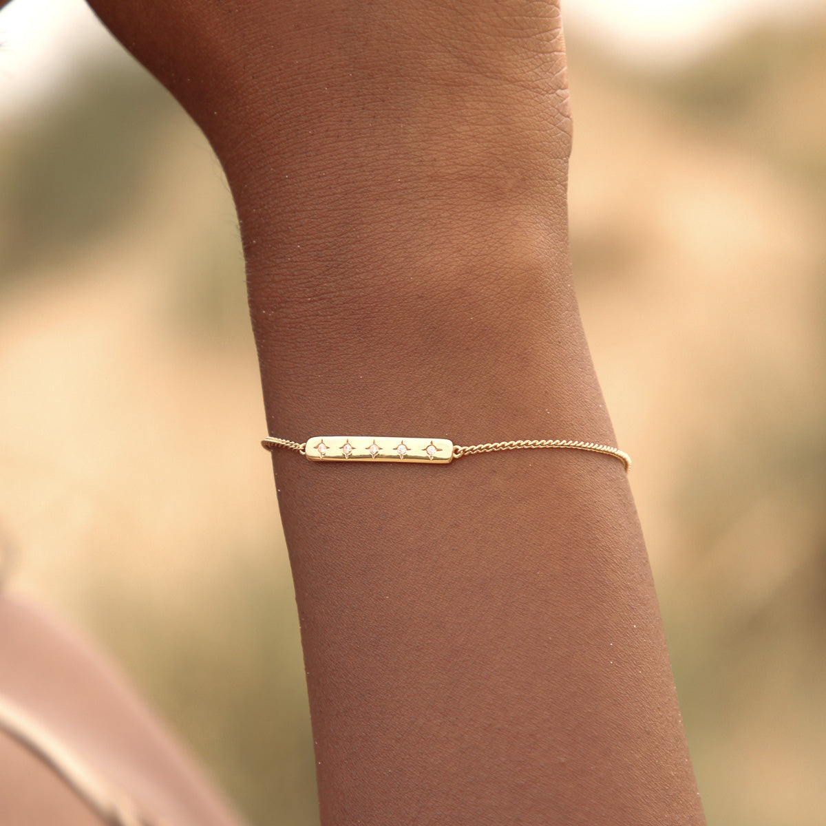 Cosmic Star Bar Bracelet in Gold worn