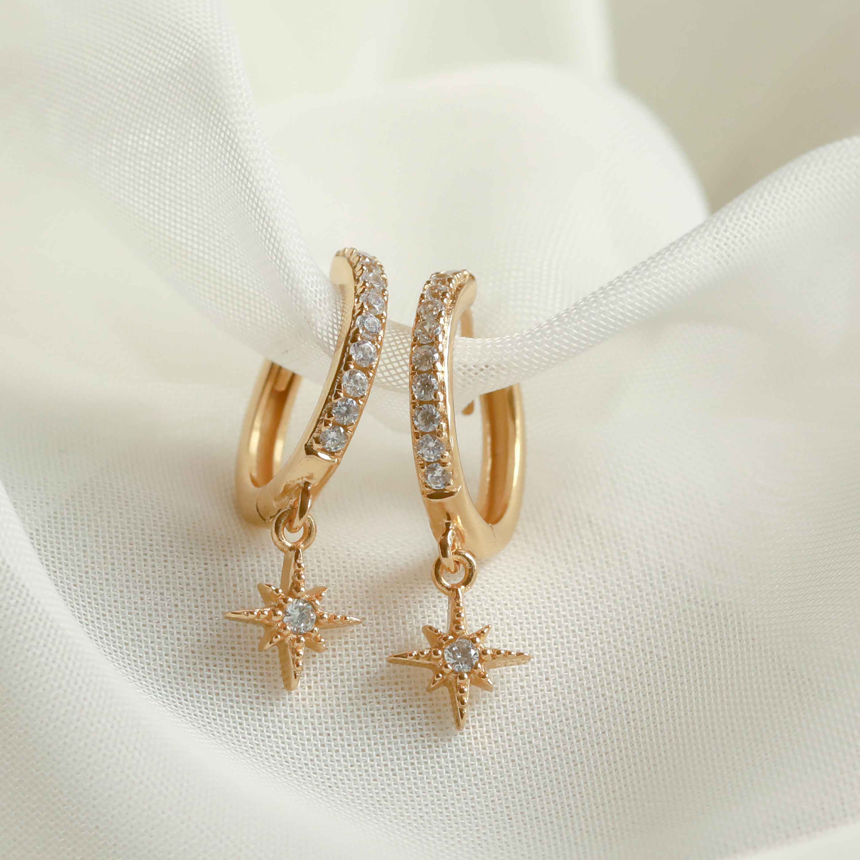Crystal Star Hoops in Gold Flat Lay