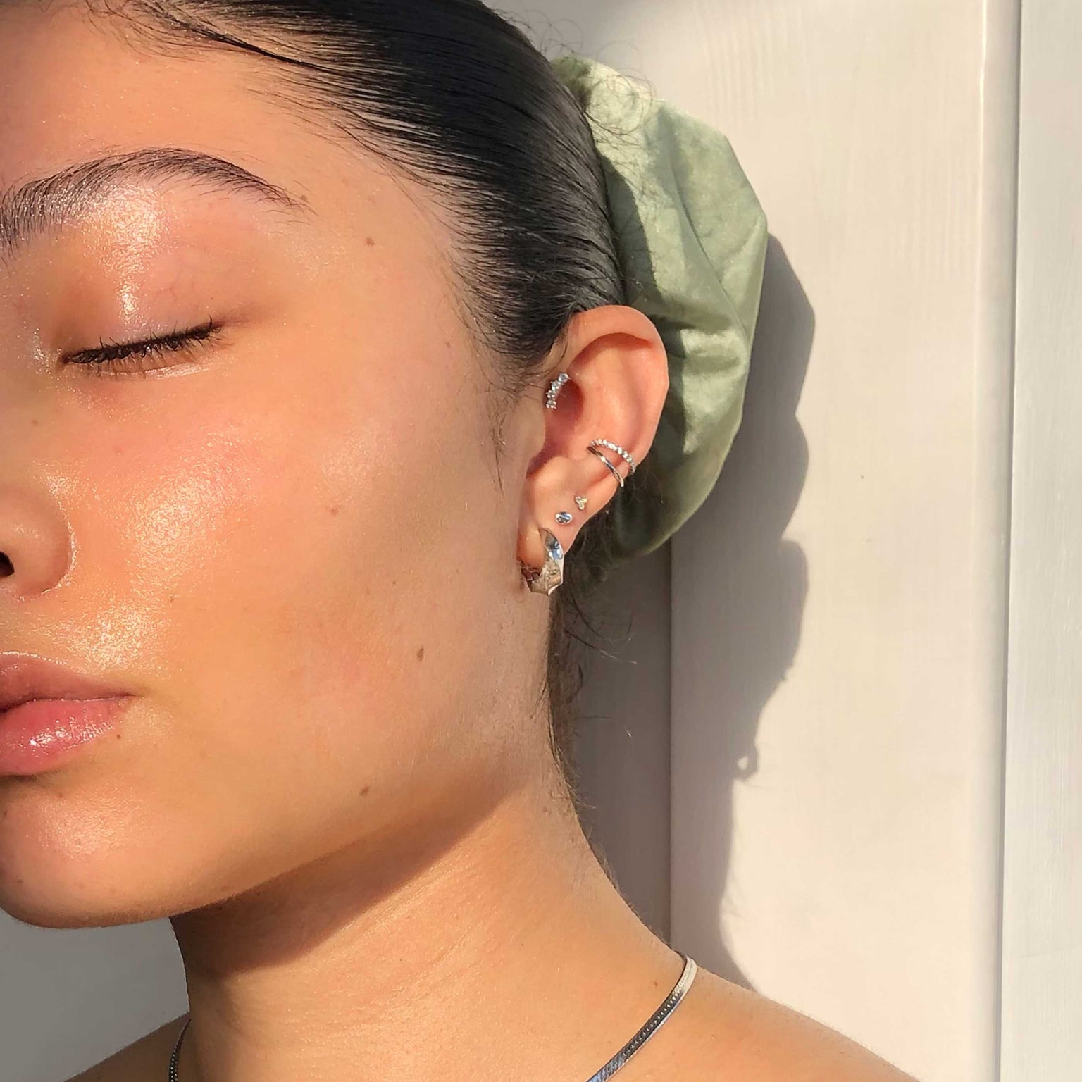 Illusion Crystal Ear Cuff in Silver worn with elemental hoops and curved crystal barbell