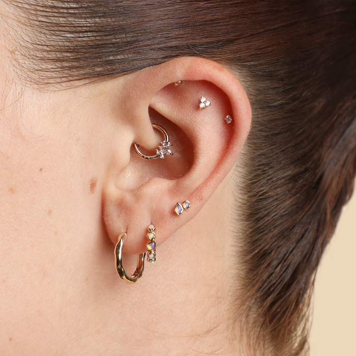 Worn shot of Daith piercing jewellery