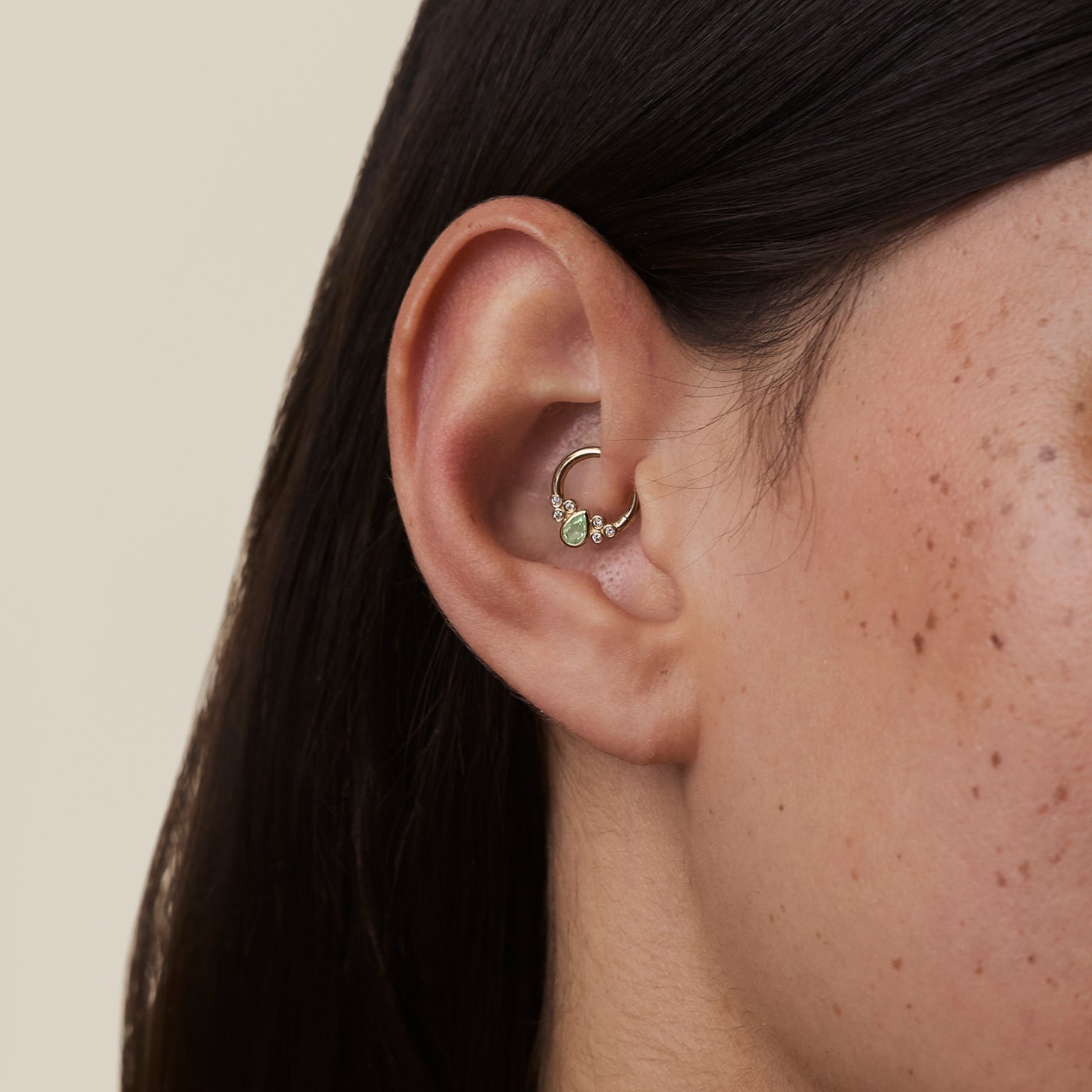 Worn shot of Daith piercing jewellery