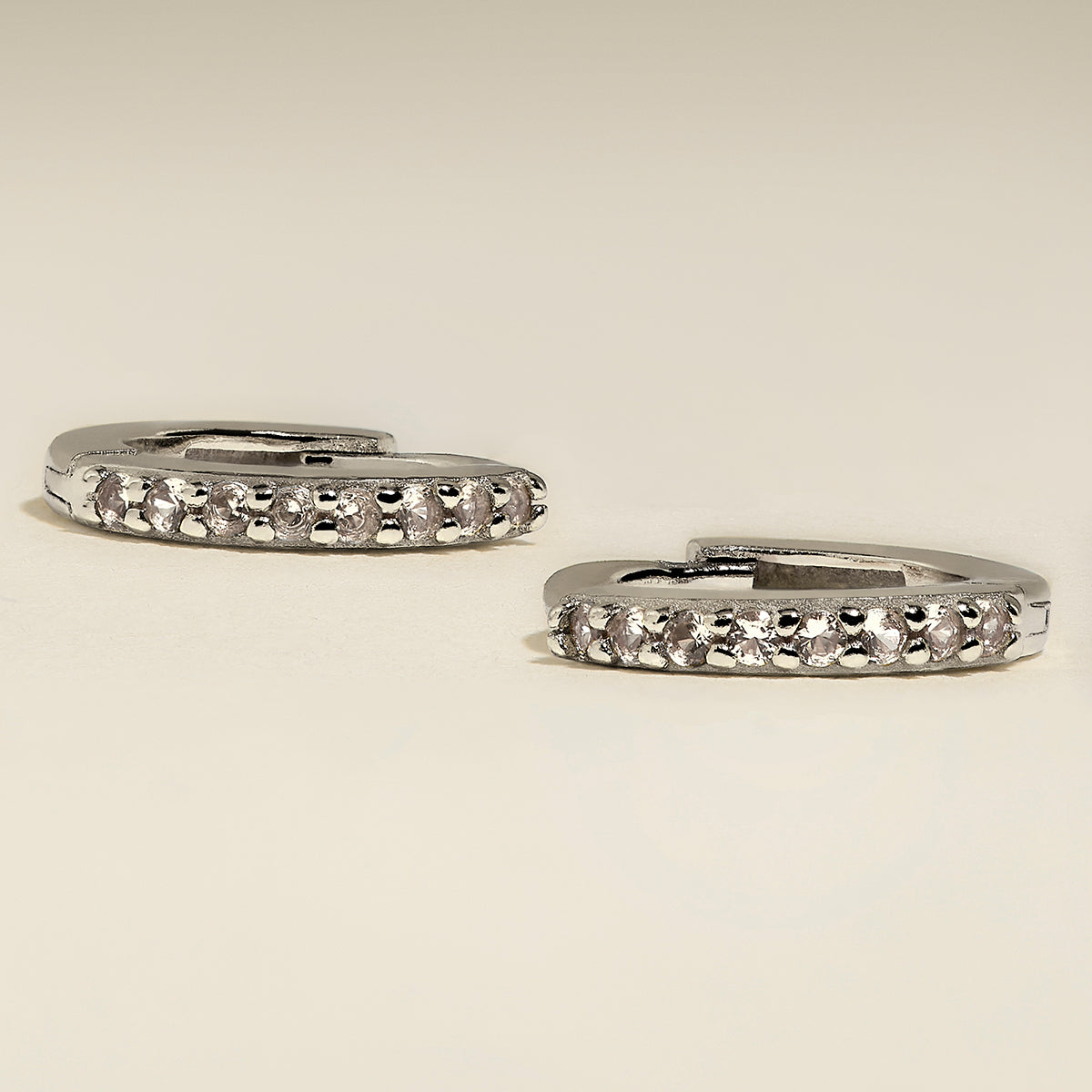 April Birthstone Huggies in Silver with White CZ