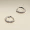 April Birthstone Huggies in Silver with White CZ