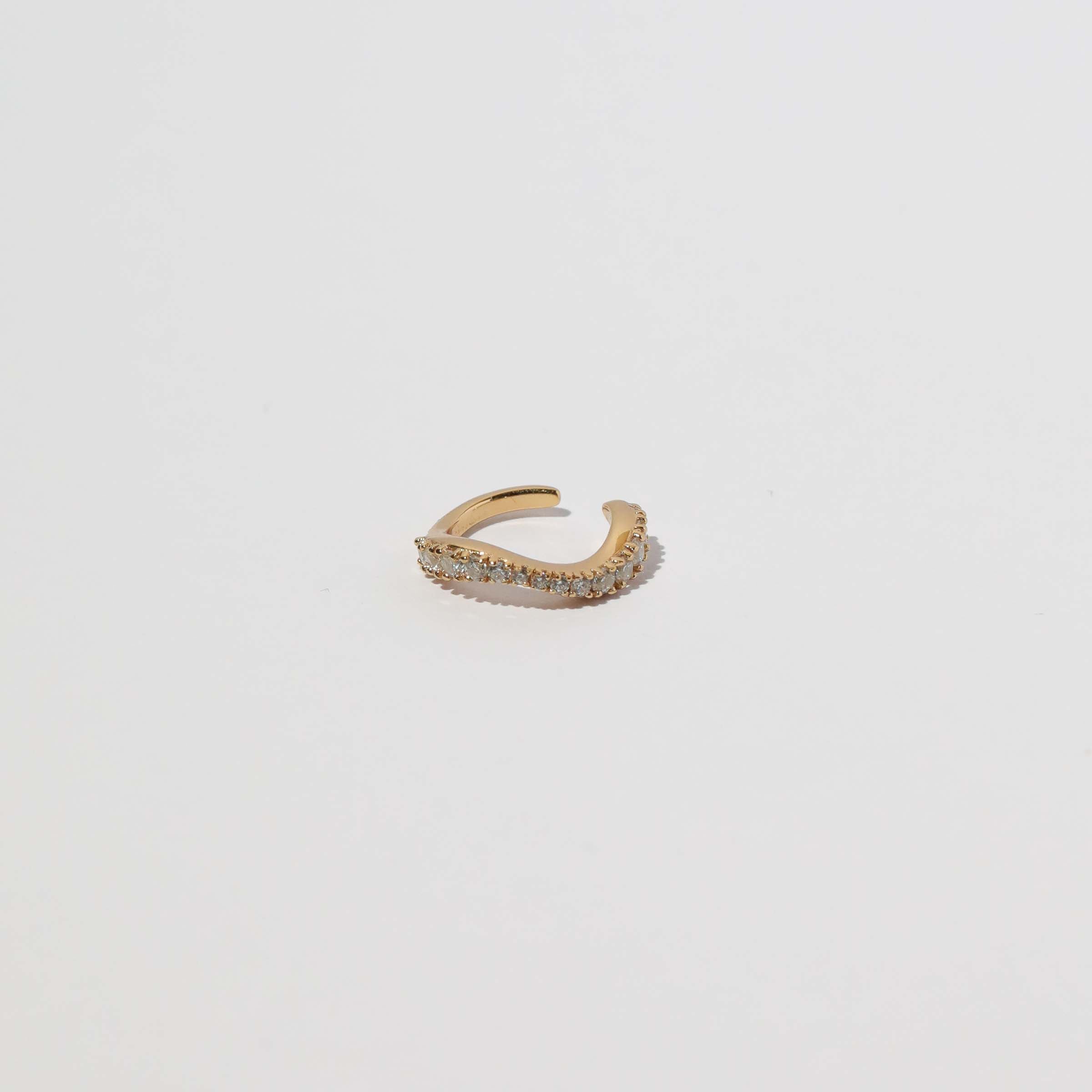 Wave Crystal Ear Cuff in Gold flat lay