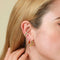 Wave Ear Cuff in Gold worn stacked with Mint and Pink Enamel Ear Cuff