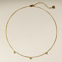 Cosmic Star Charm Necklace in Gold