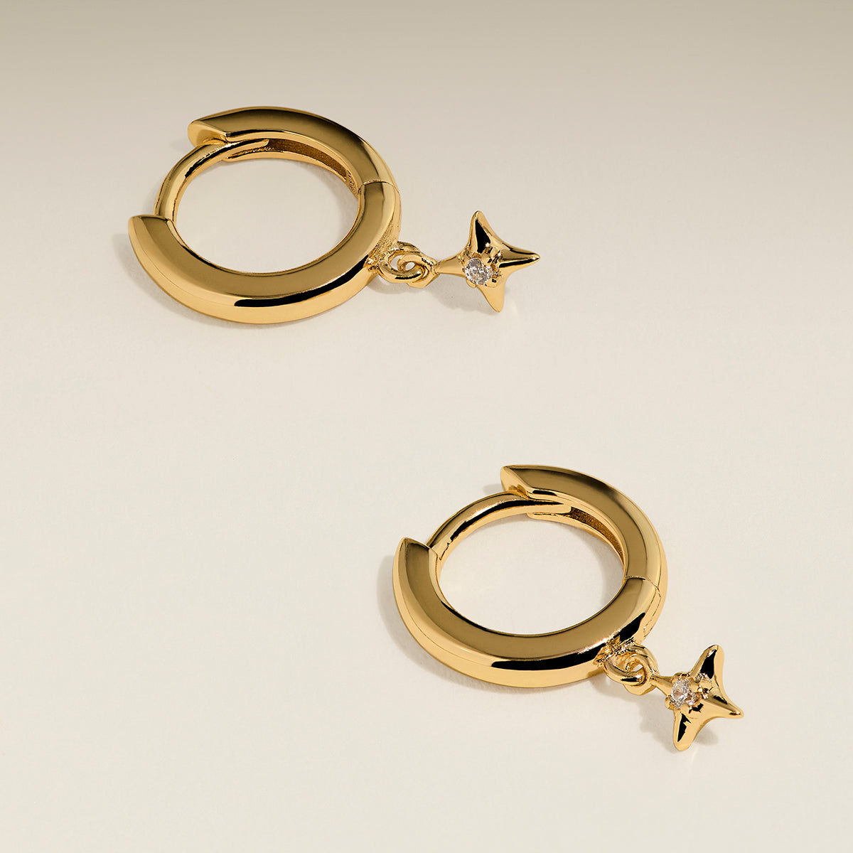 Cosmic Star Charm Huggies in Gold