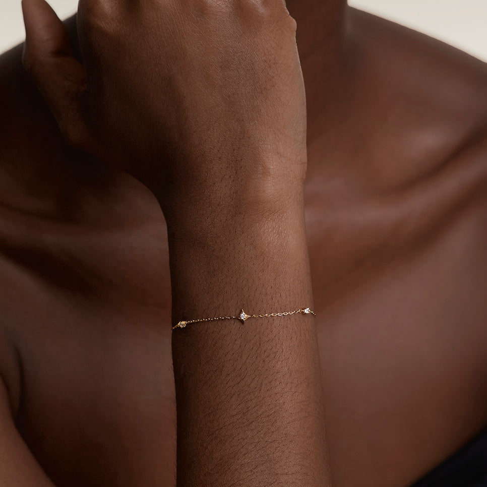 Cosmic Star Charm Bracelet in Gold