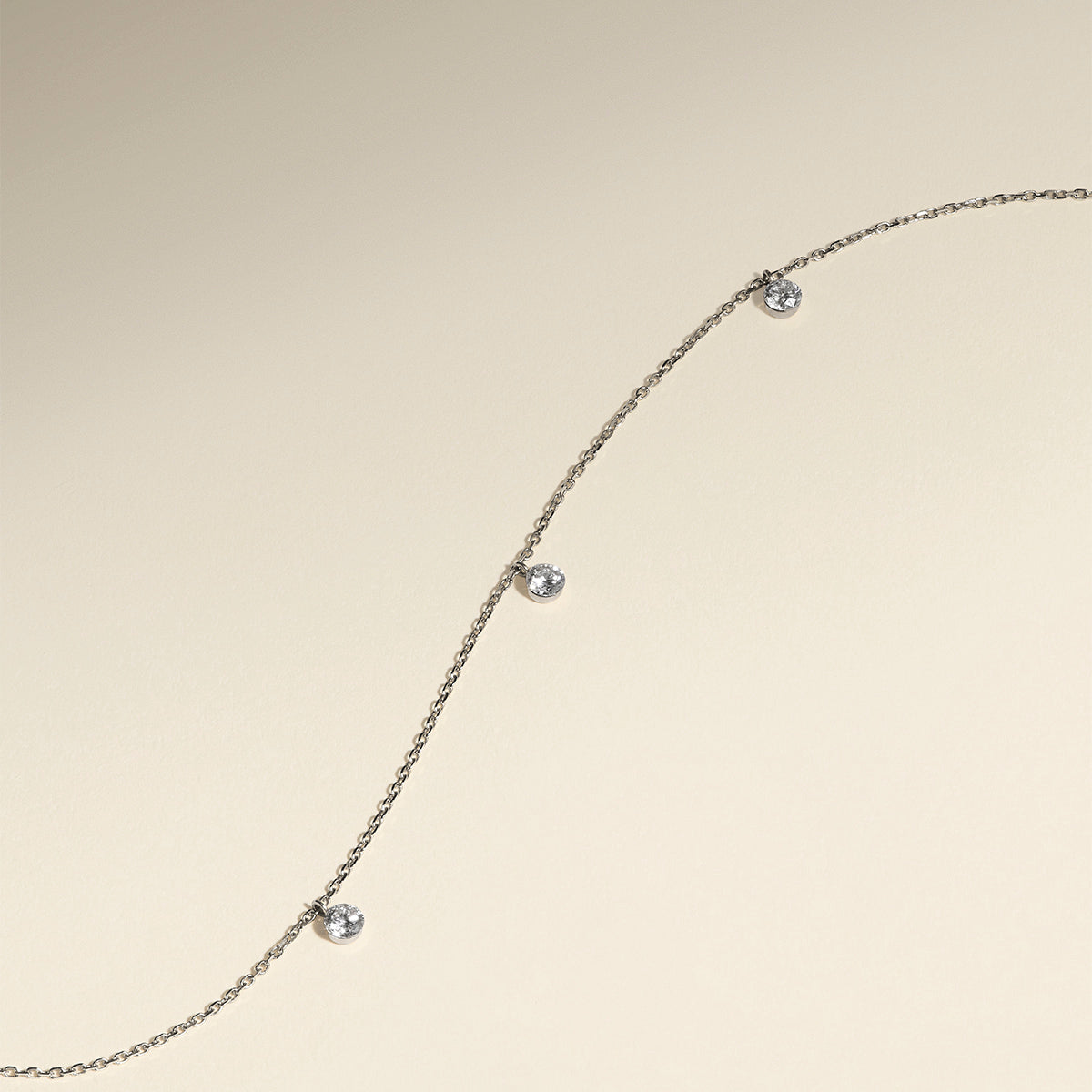 Floating Diamond Charm Bracelet in Solid White Gold