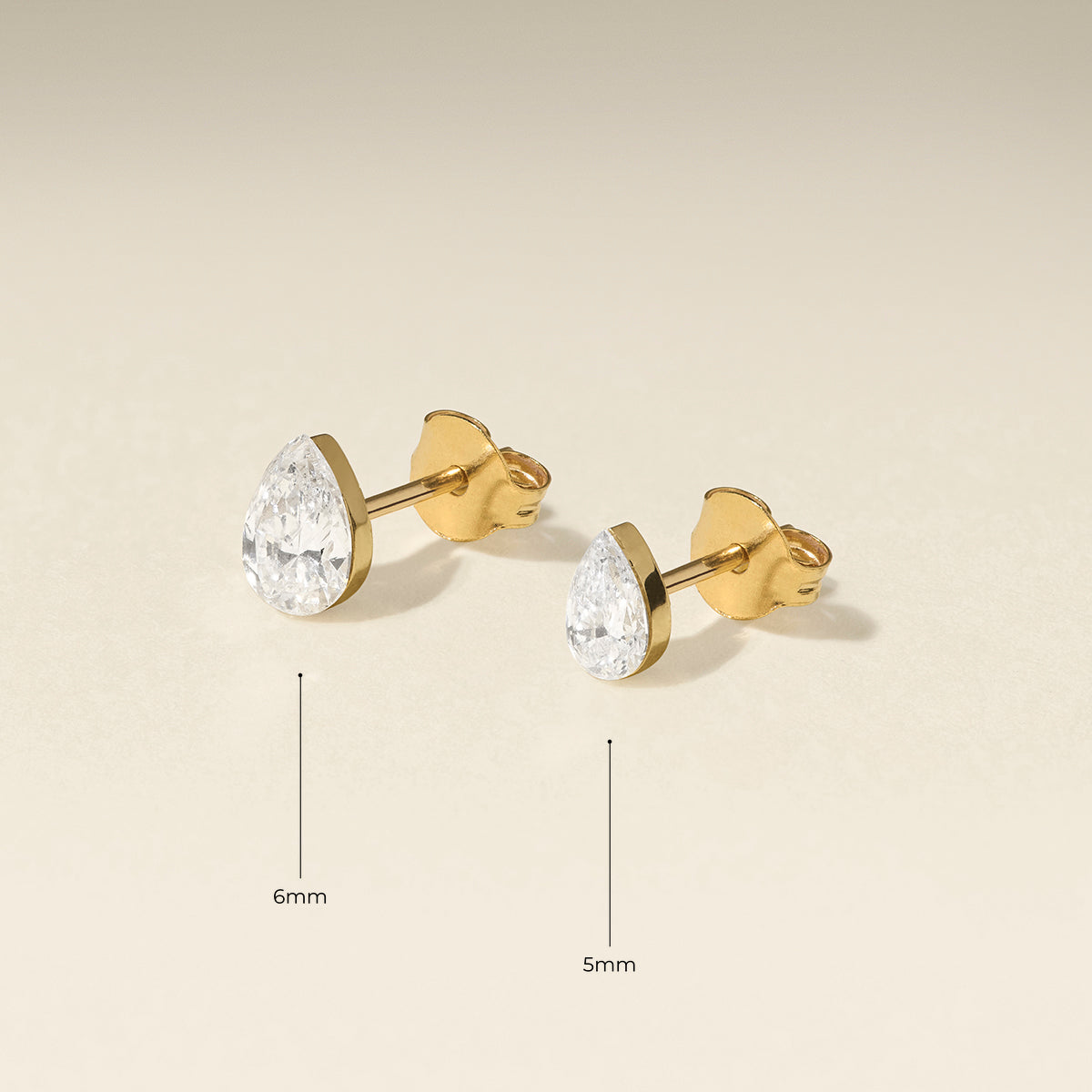 Floating Pear Diamond Stud Earrings in Solid Gold