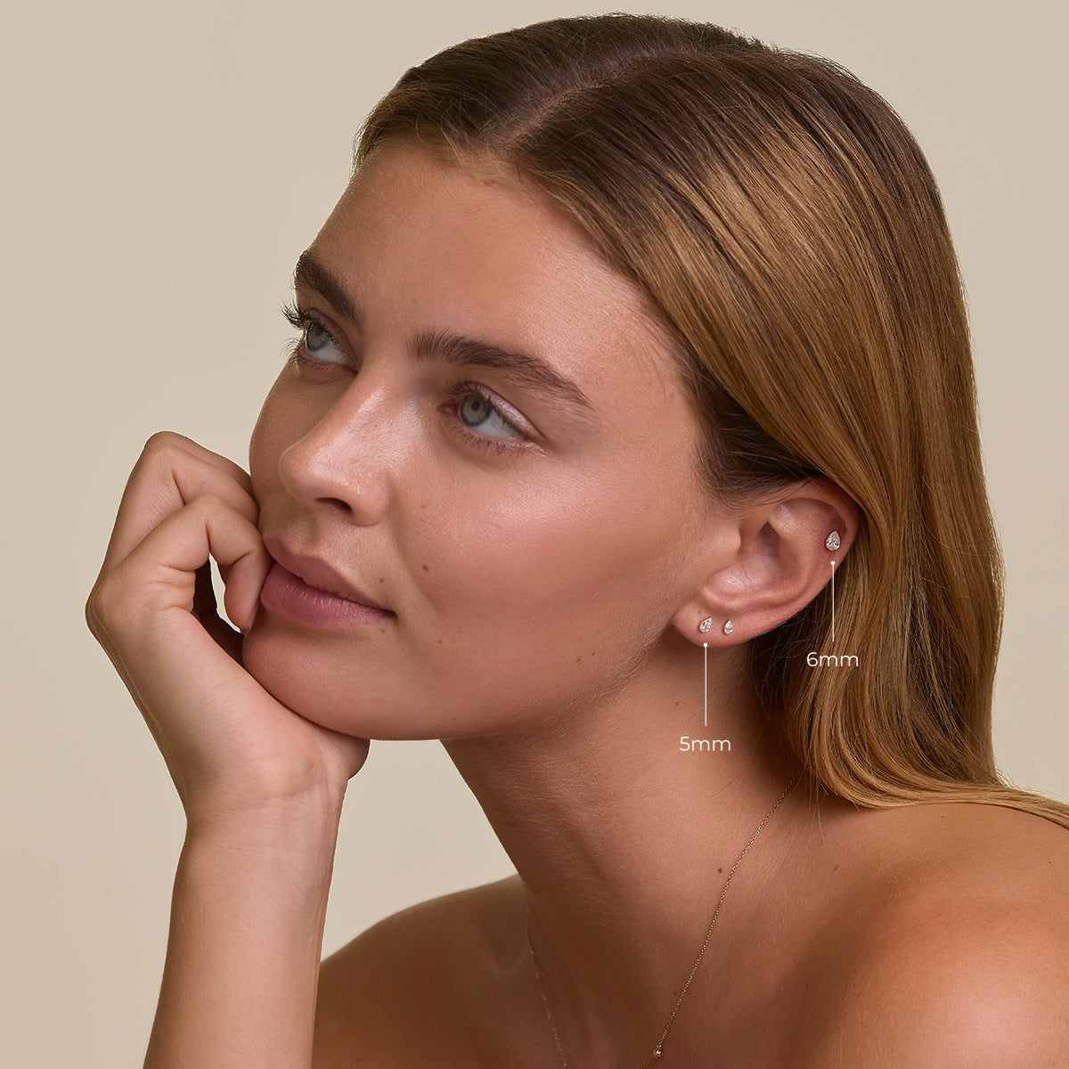 Floating Pear Diamond Stud Earrings in Solid Gold