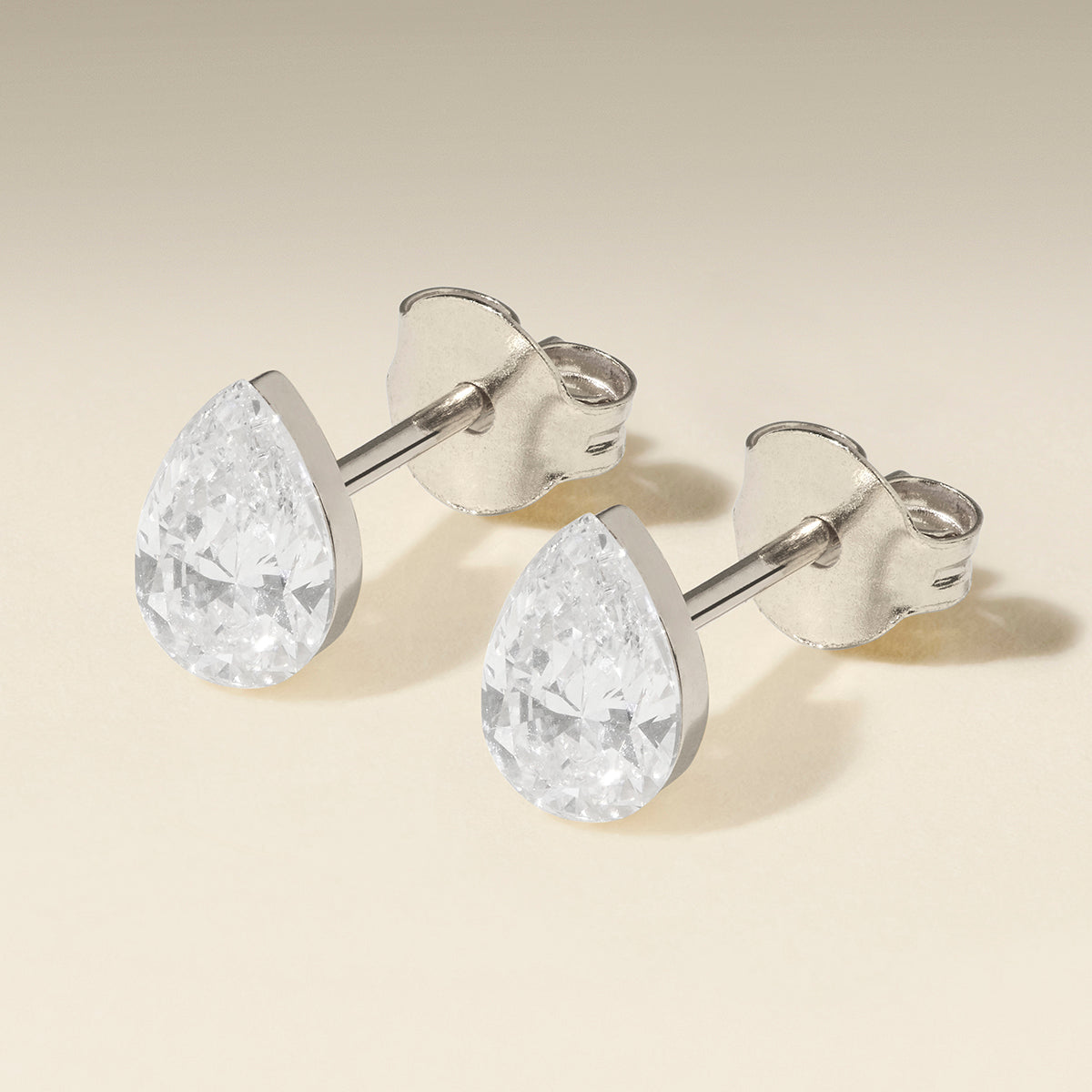 Floating Pear Diamond Stud Earrings in Solid White Gold